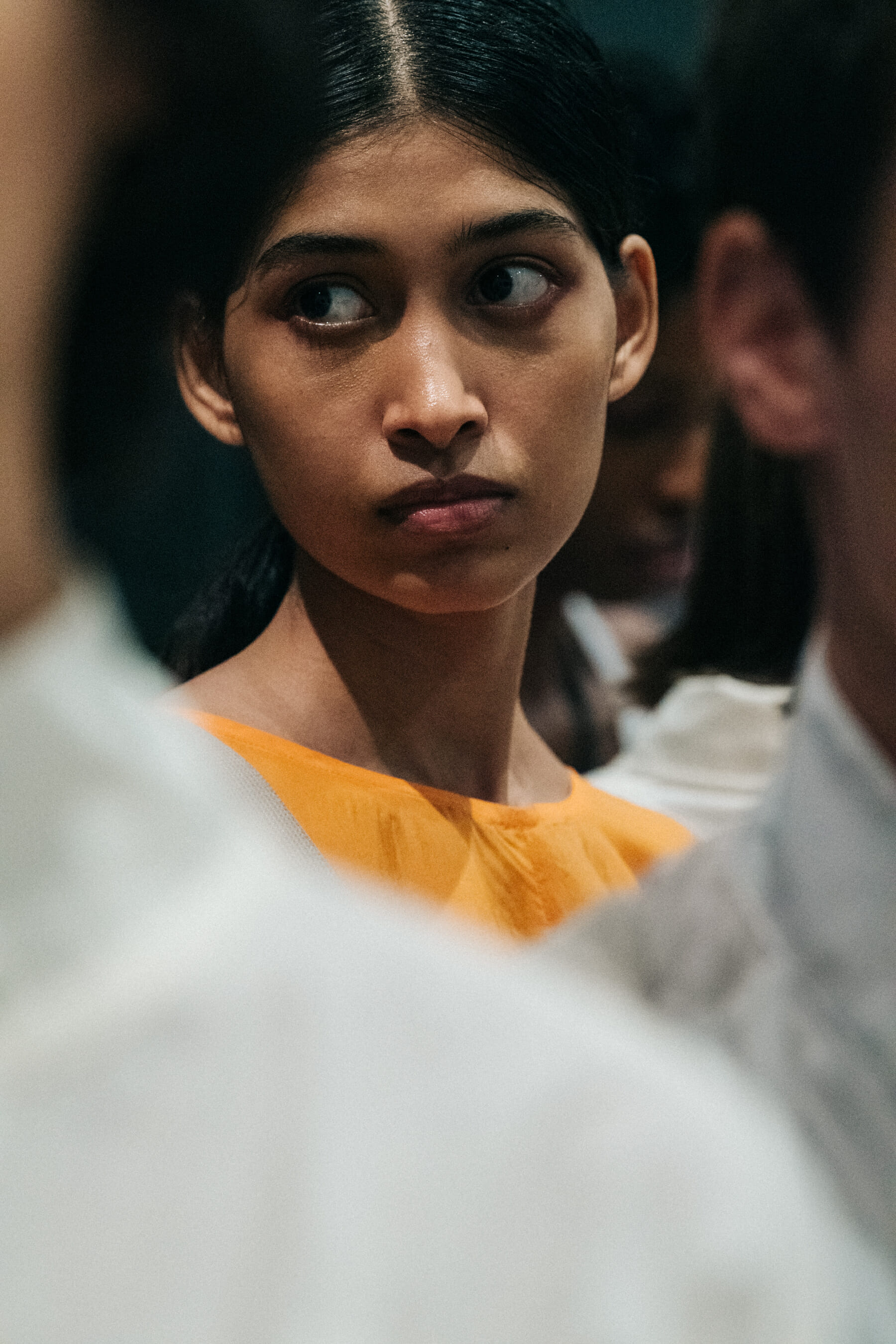 Model wearing orange outfit at Nehera