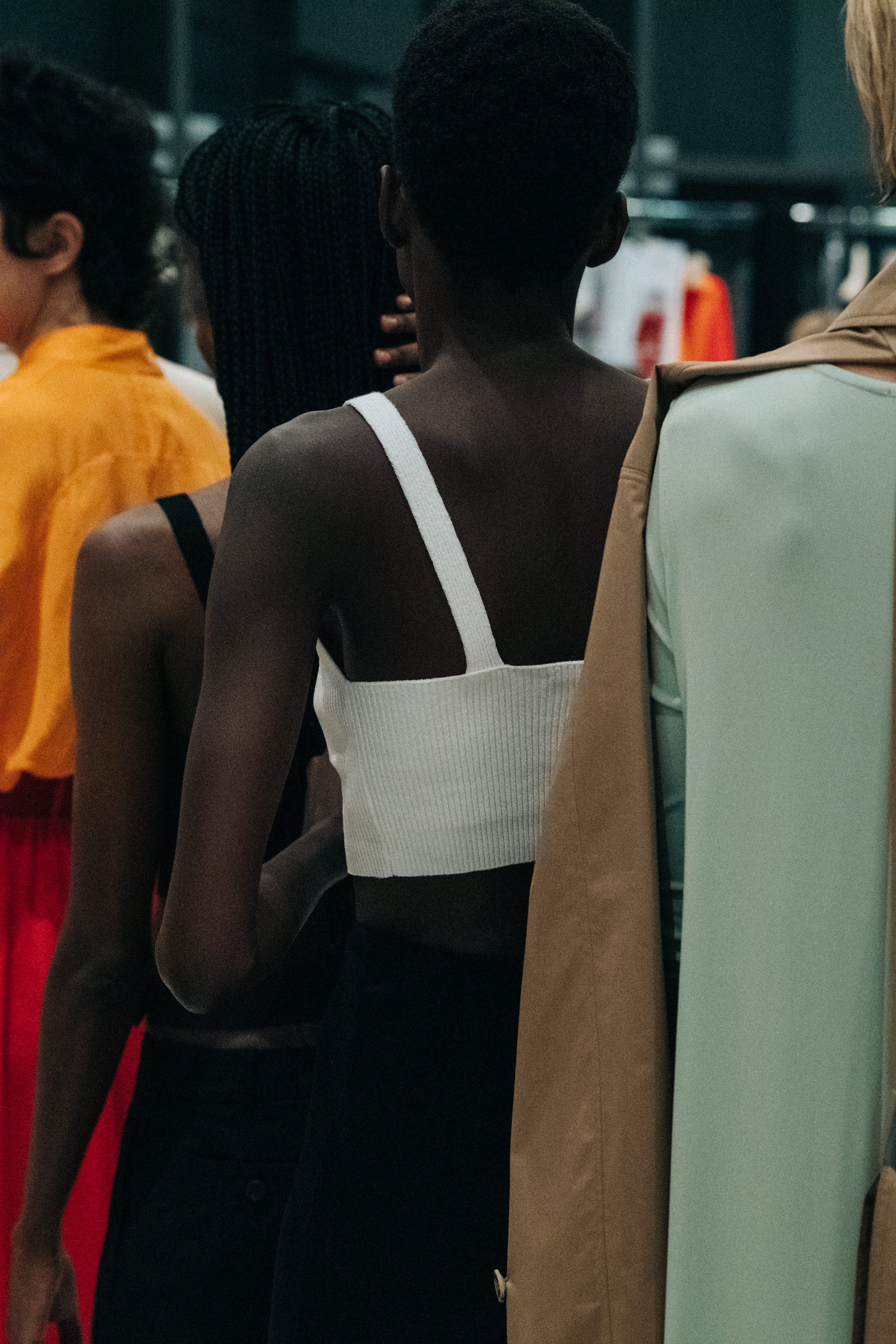 Model wearing white vest at Nehera