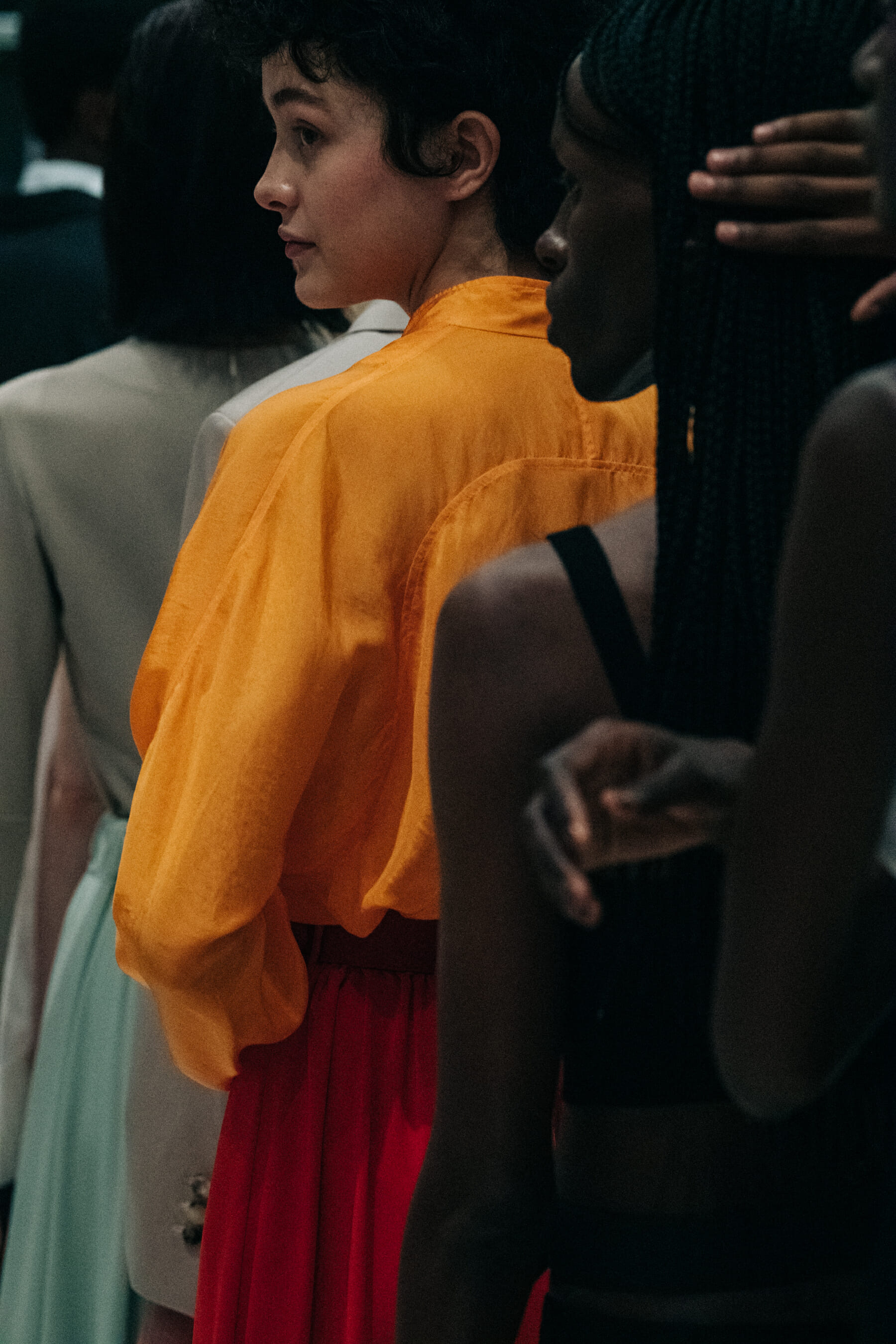Model wearing orange outfit at Nehera