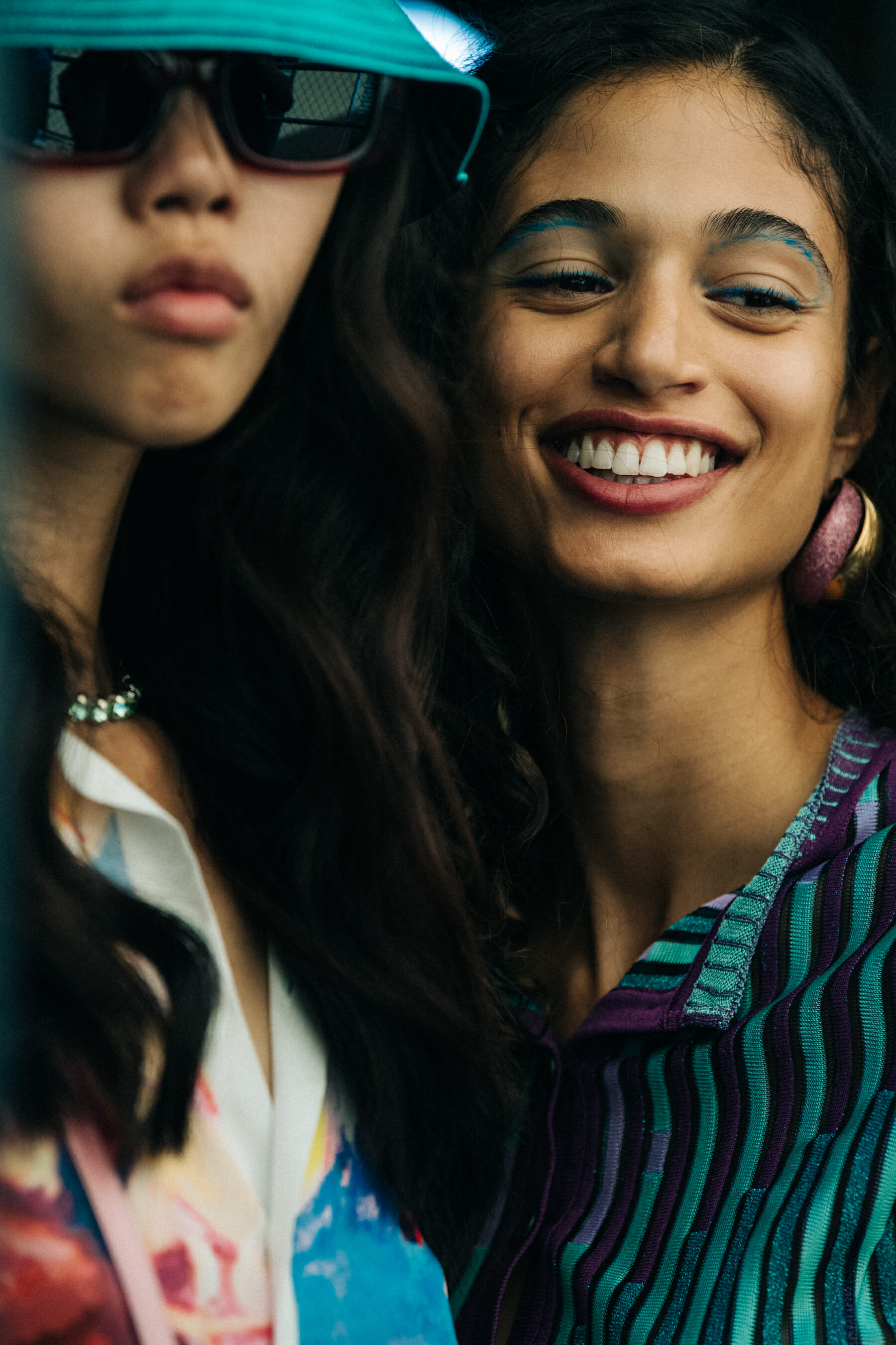 Model wearing colourful bucket hat