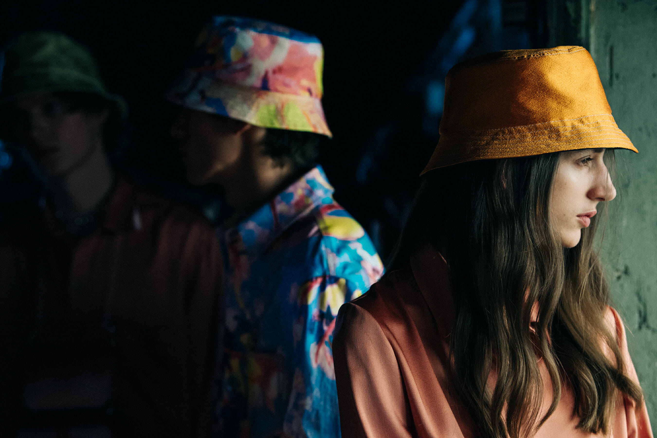 Model wearing colourful bucket hat