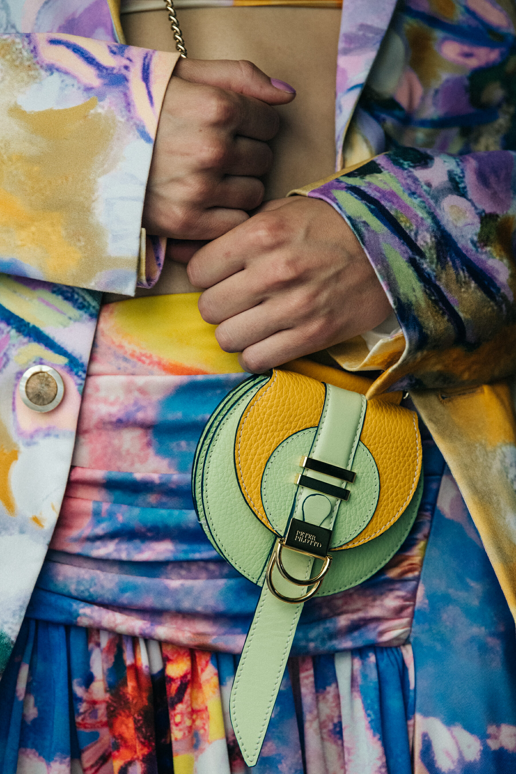 Model holding colourful bag