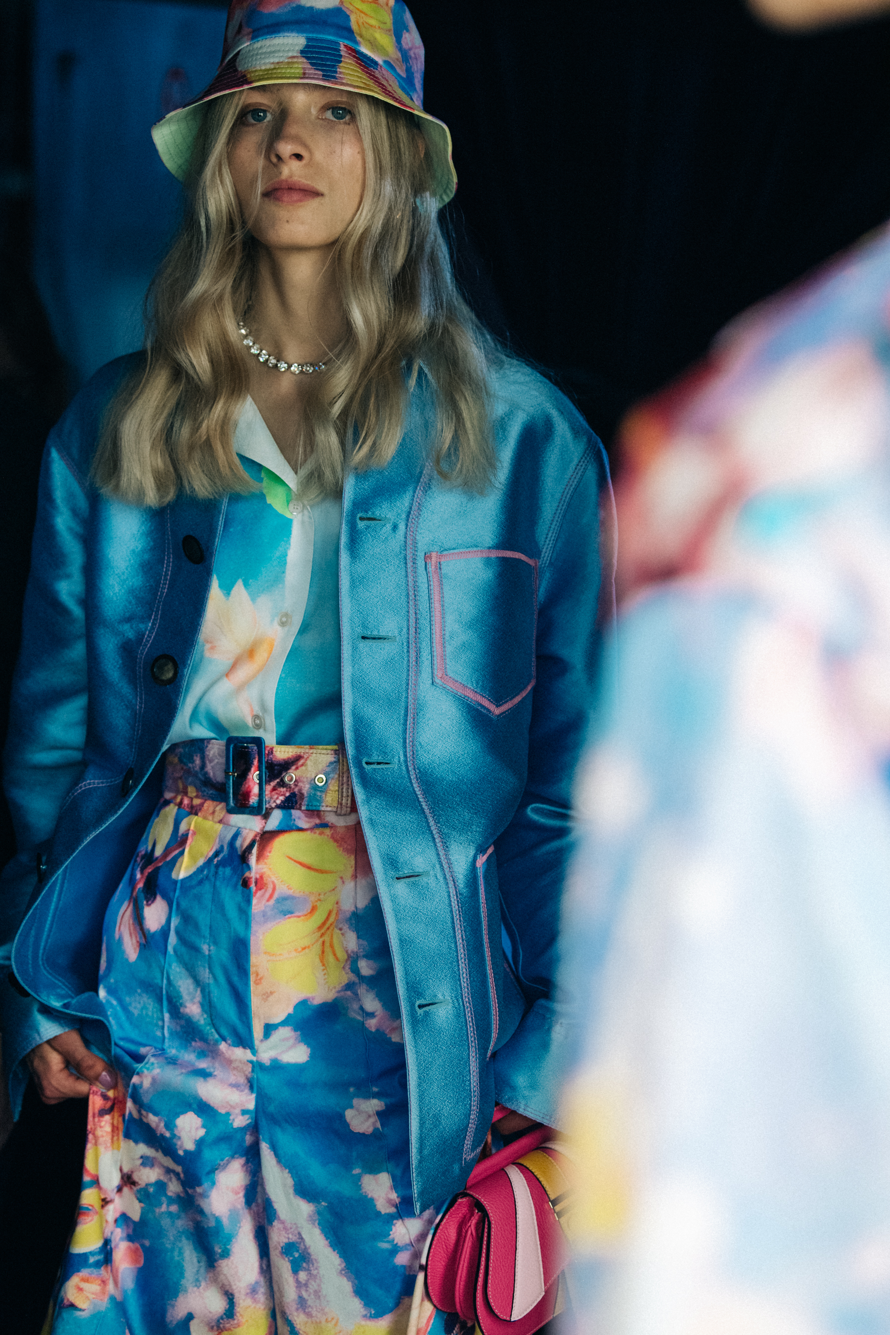 Model wearing colourful bucket hat