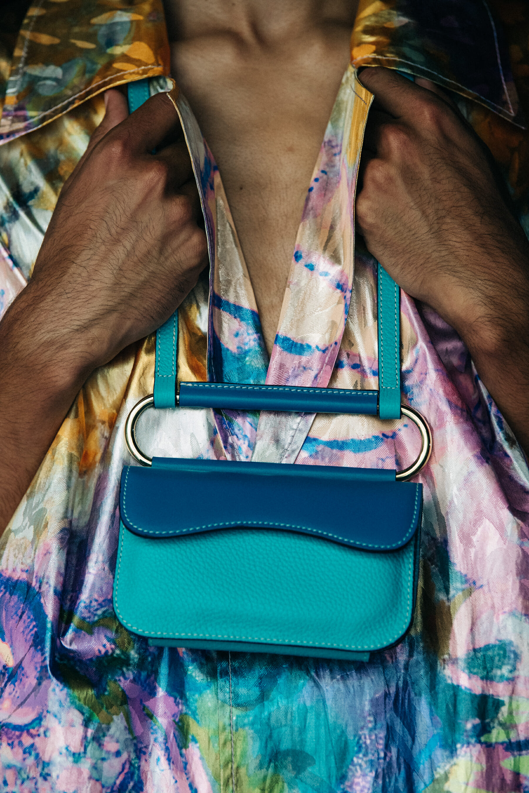 Model holding colourful bag