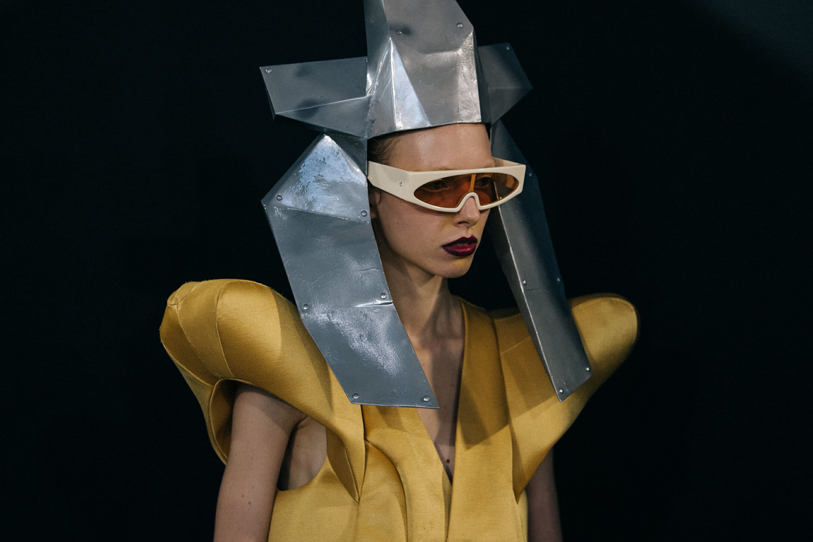 Models wearing yellow outfit backstage at Rick Owens