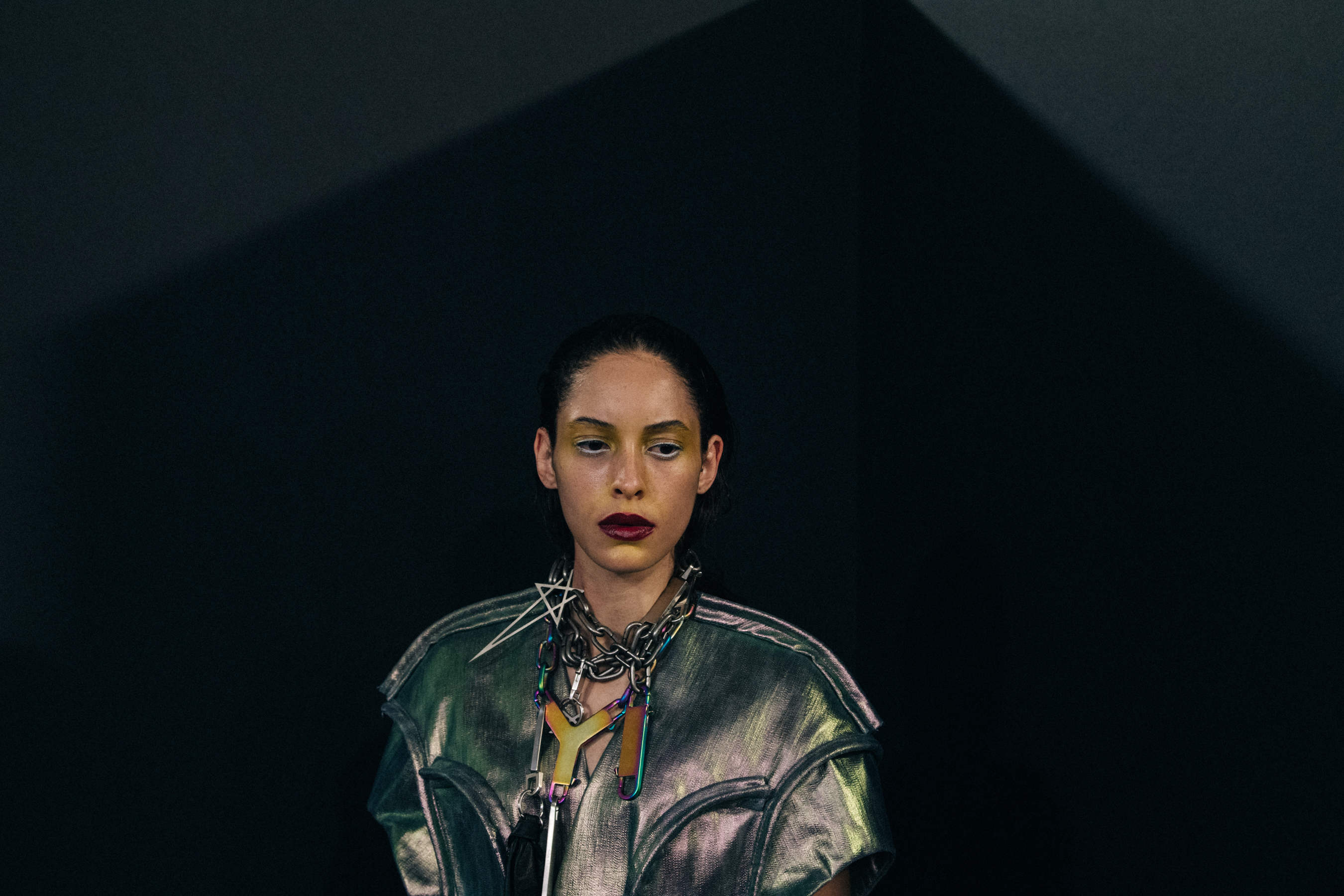 Models wearing silver outfit backstage at Rick Owens