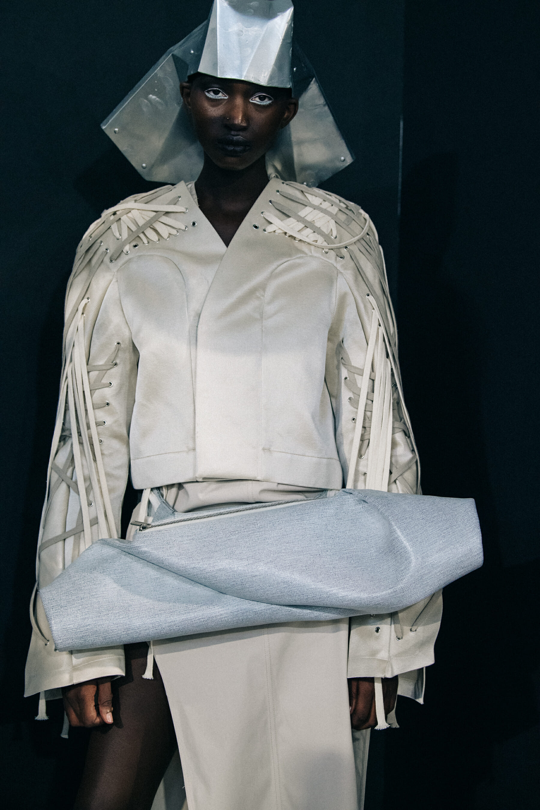 Models wearing helmets backstage at Rick Owens