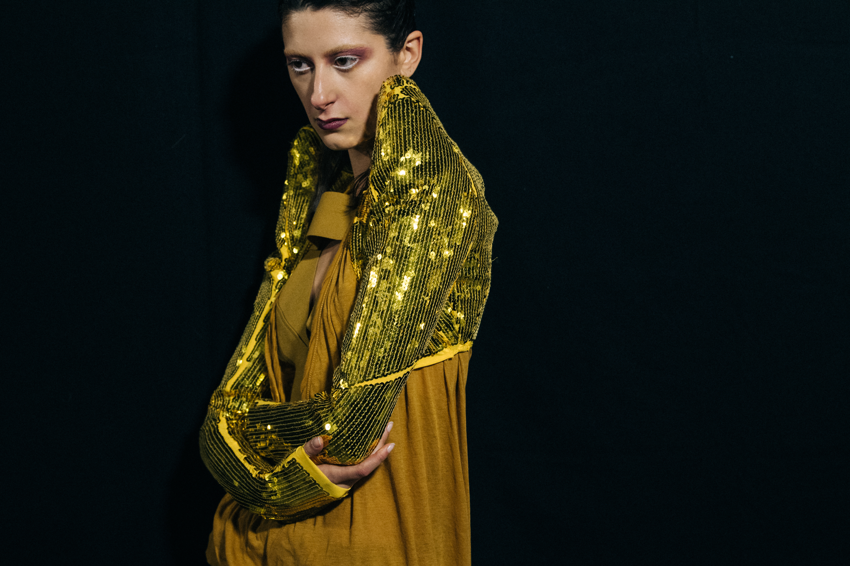 Models wearing yellow outfit backstage at Rick Owens