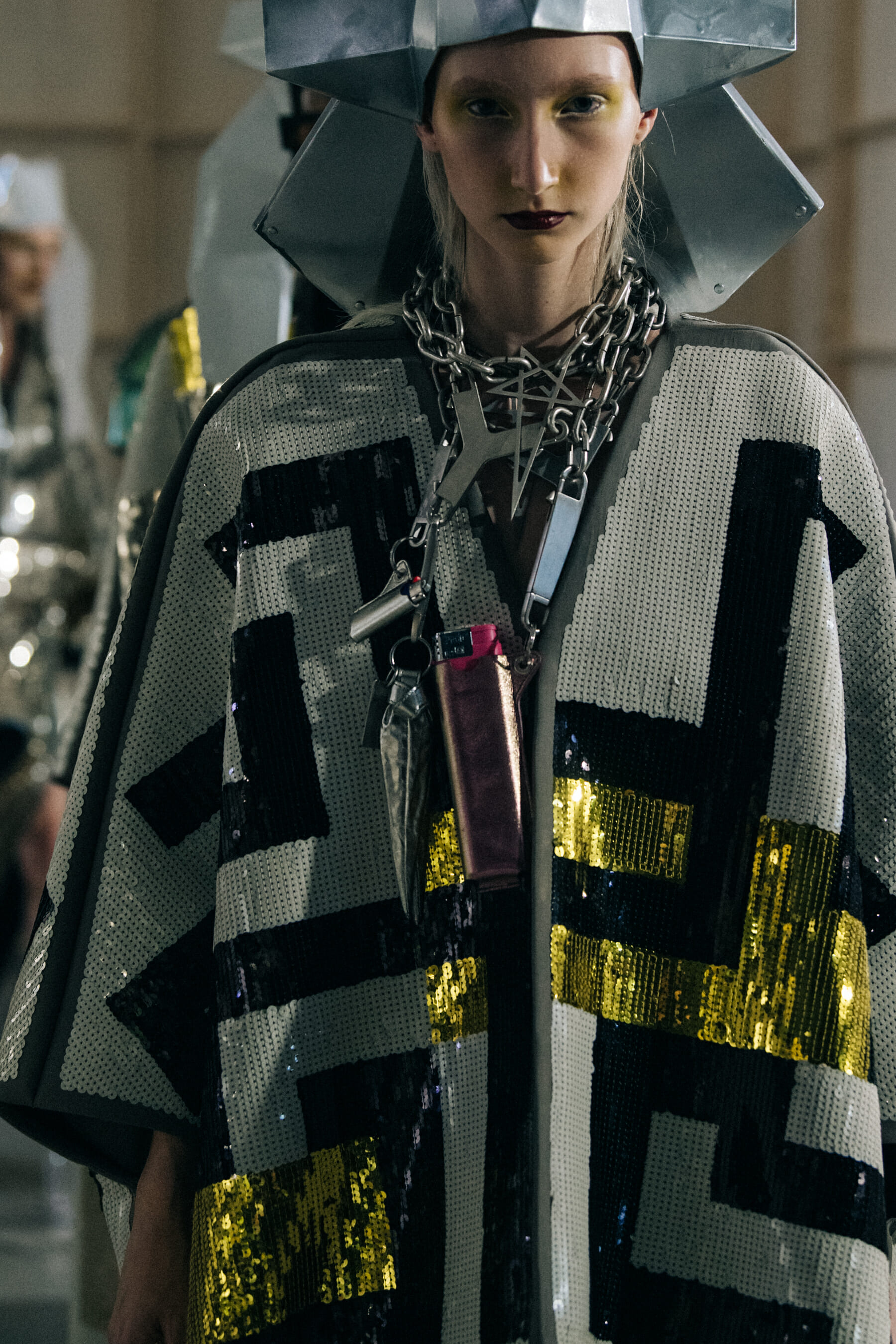 Models wearing silver outfit backstage at Rick Owens