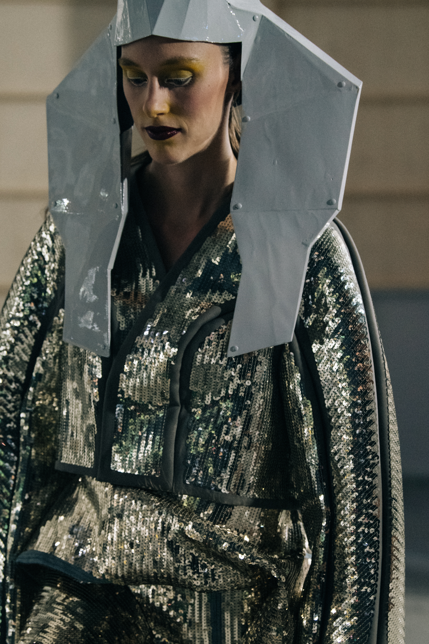 Models wearing silver outfit backstage at Rick Owens