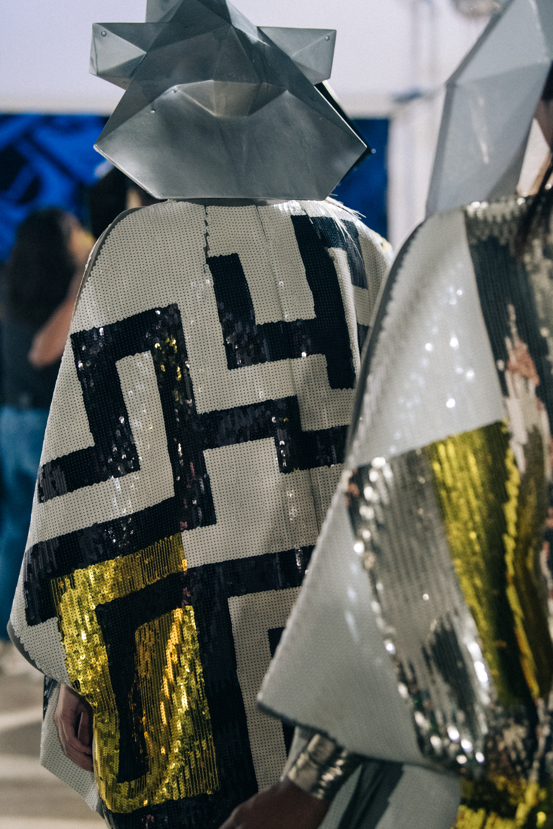 Models wearing silver outfit backstage at Rick Owens