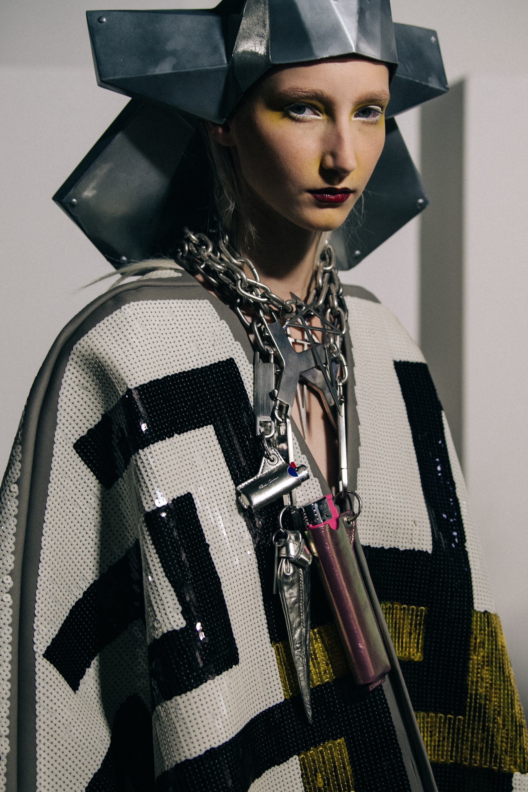 Models wearing silver outfit backstage at Rick Owens
