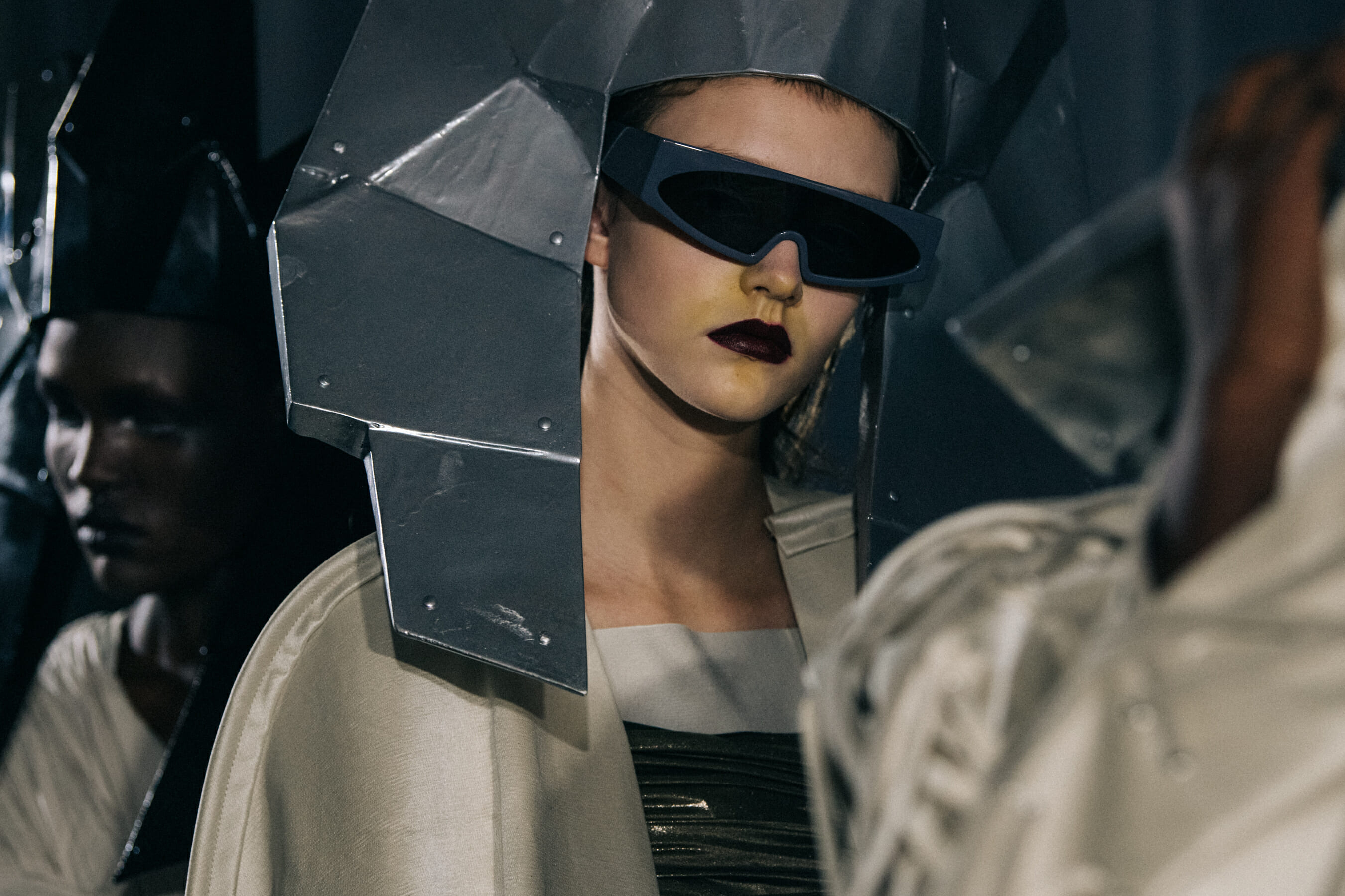 Models wearing silver outfit backstage at Rick Owens