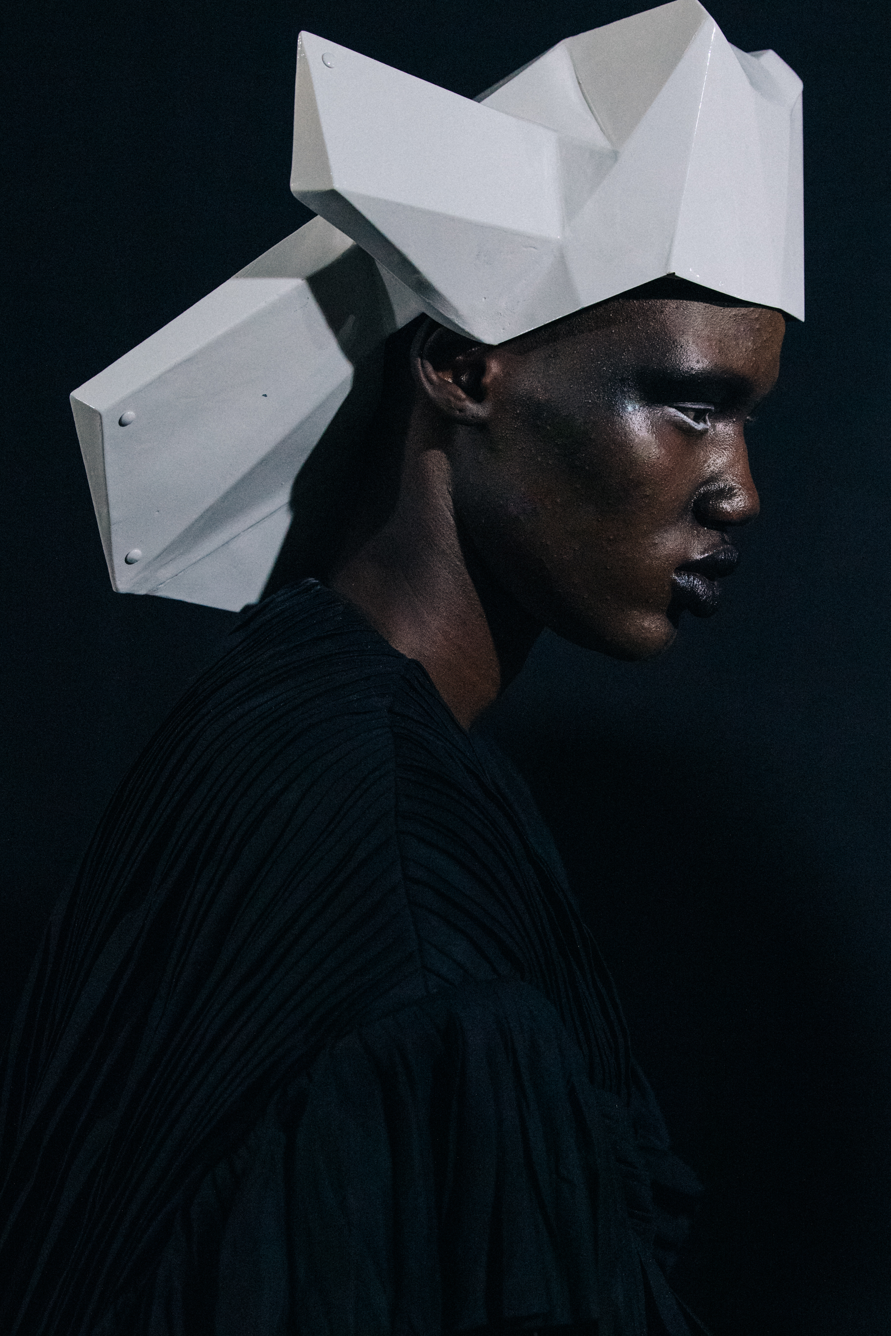 Models wearing helmets backstage at Rick Owens