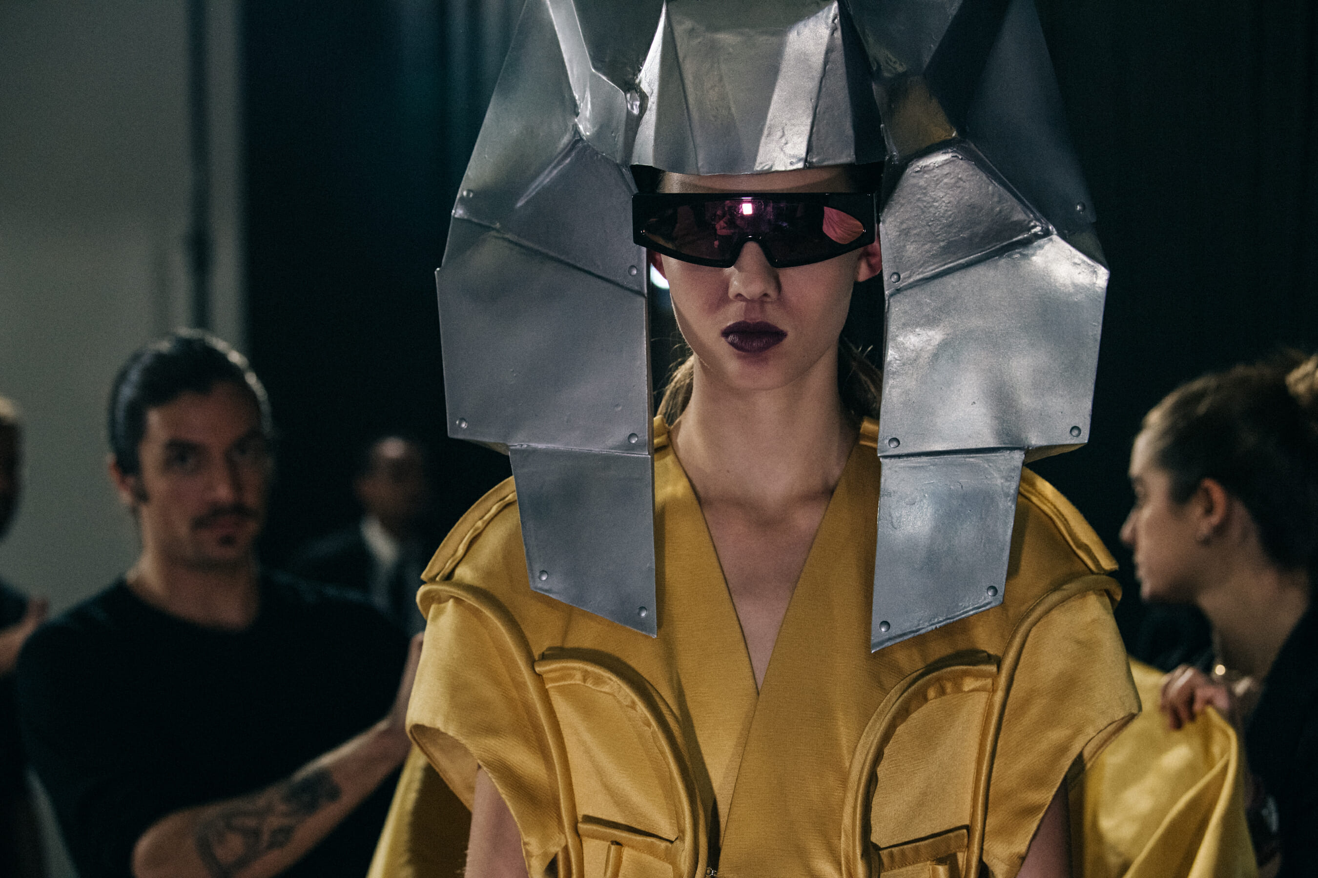 Models wearing yellow outfit backstage at Rick Owens