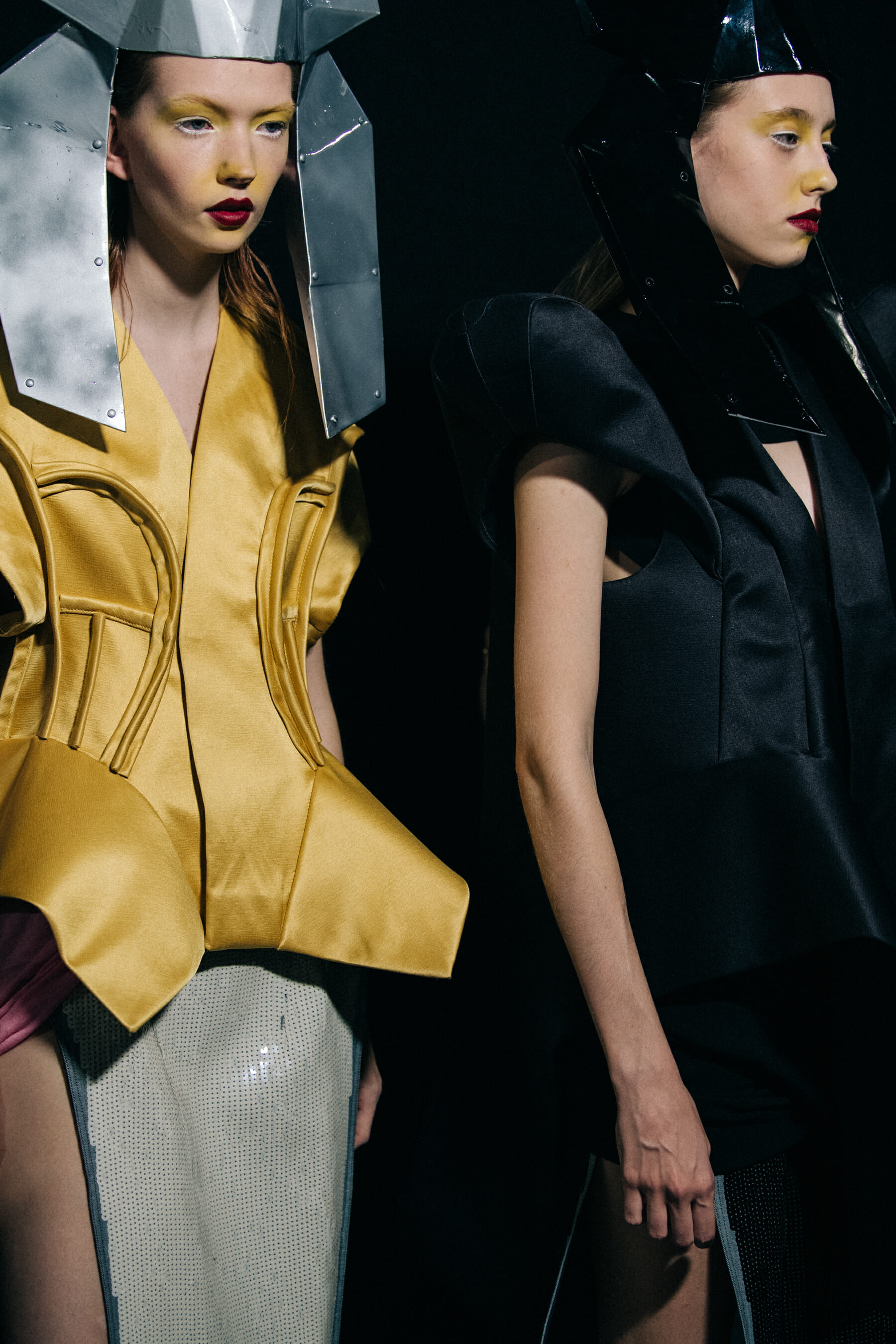 Models wearing yellow outfit backstage at Rick Owens