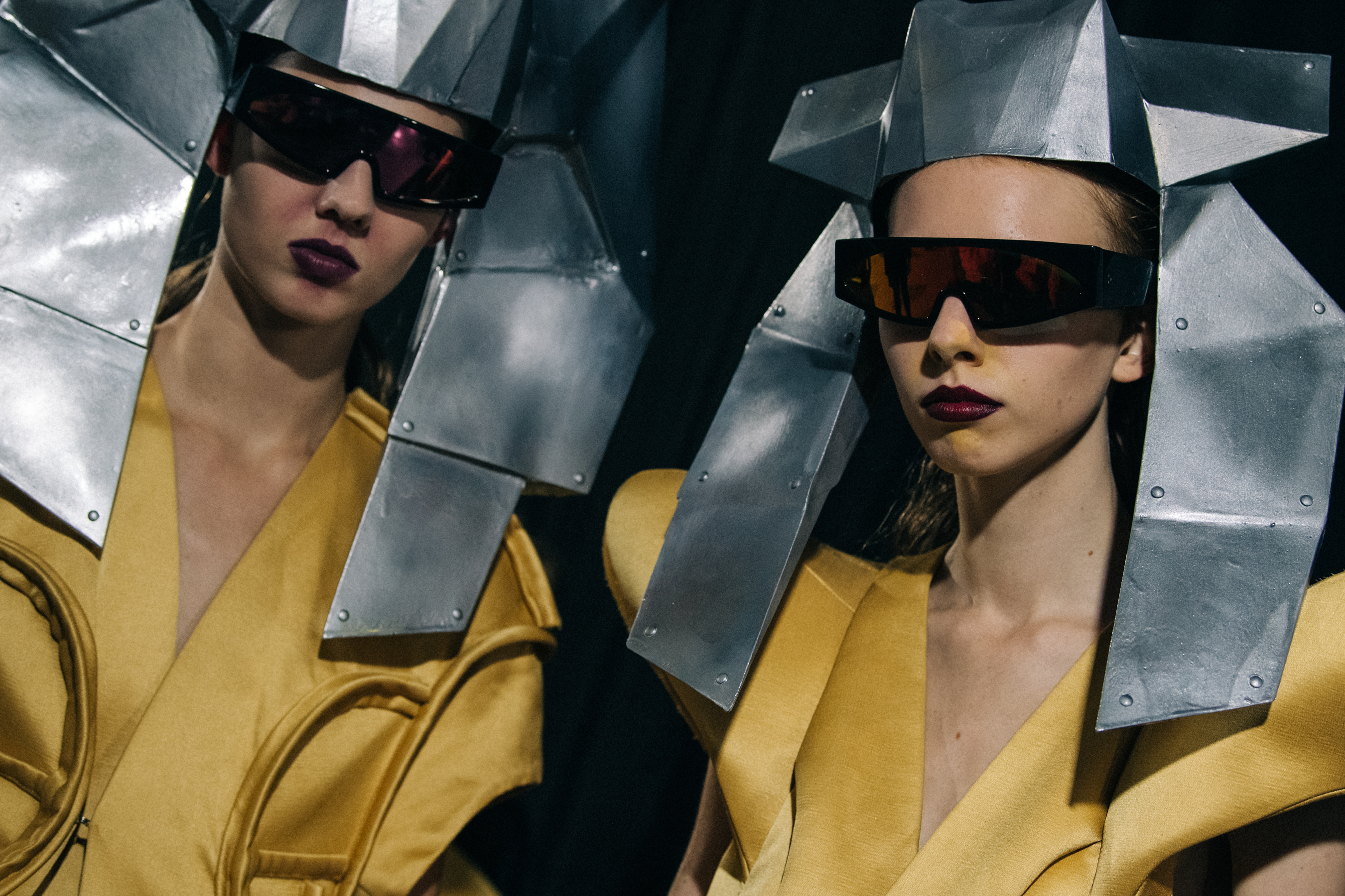 Models wearing yellow outfit backstage at Rick Owens