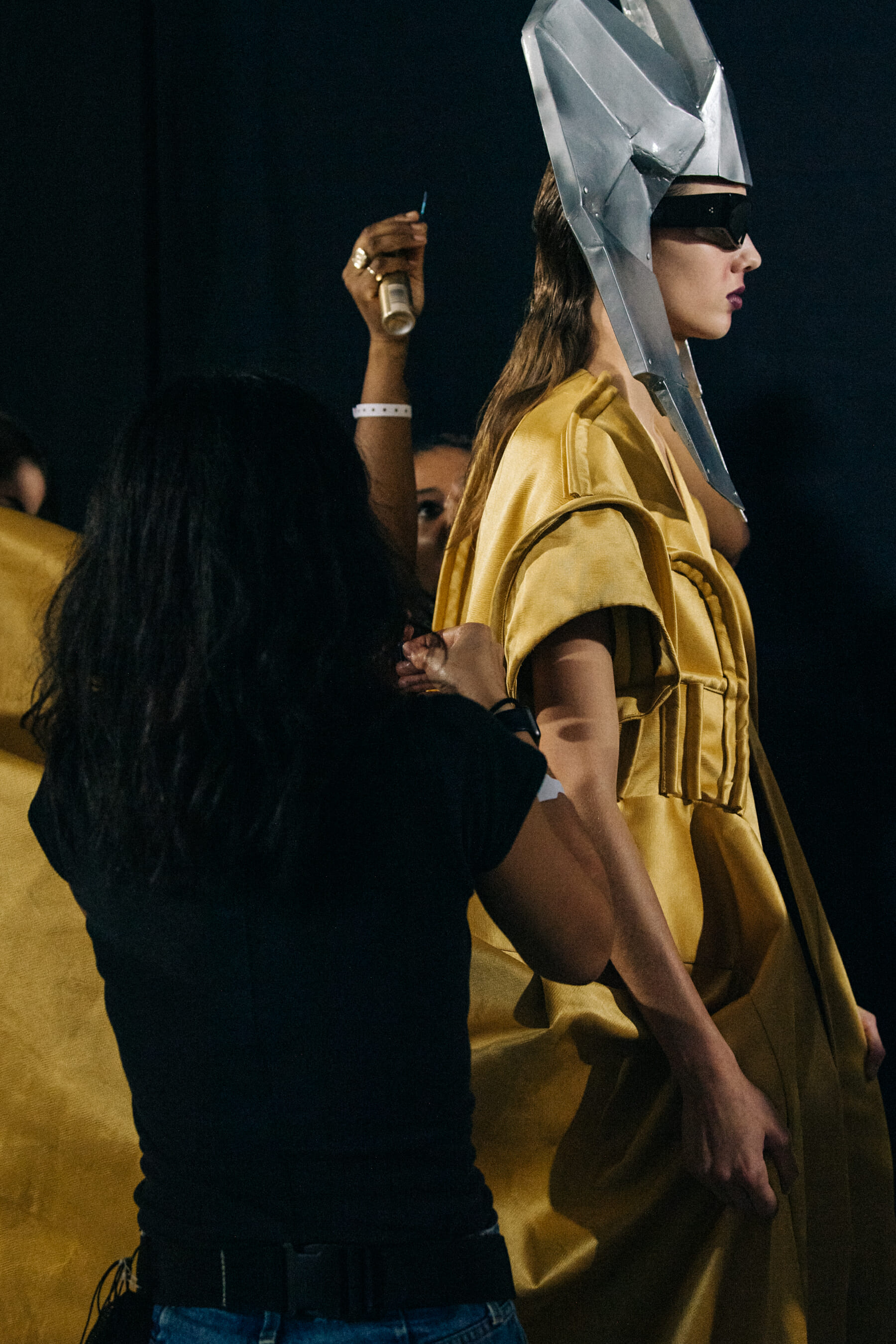 Models wearing yellow outfit backstage at Rick Owens