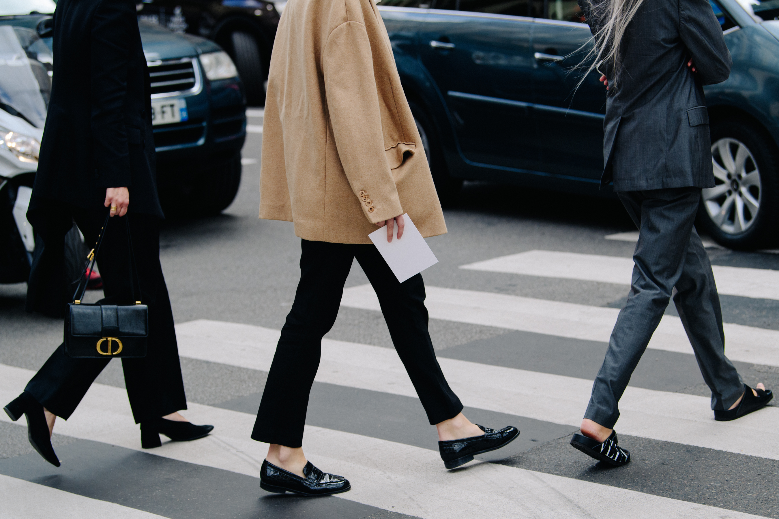Three women crossing road
