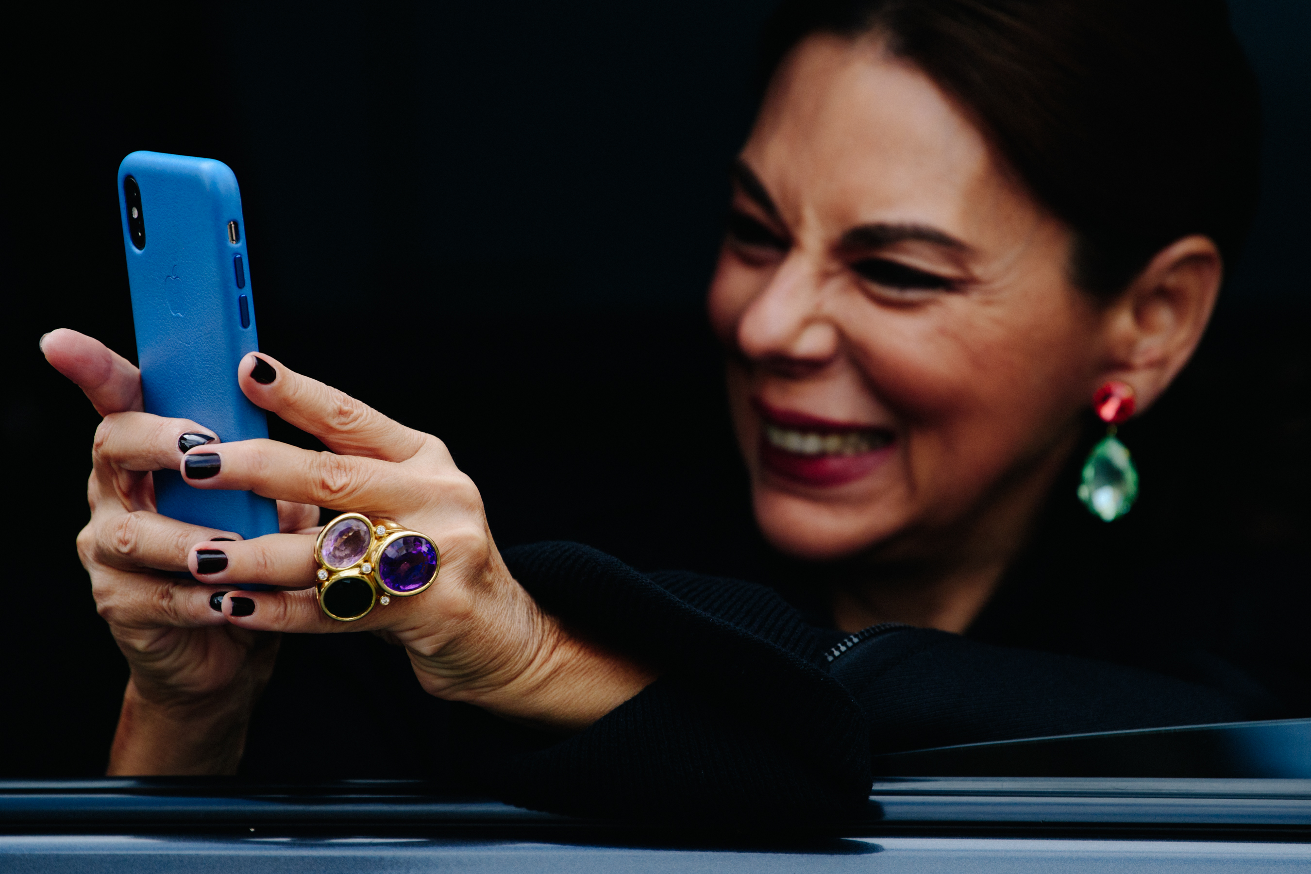 Woman using blue iPhone
