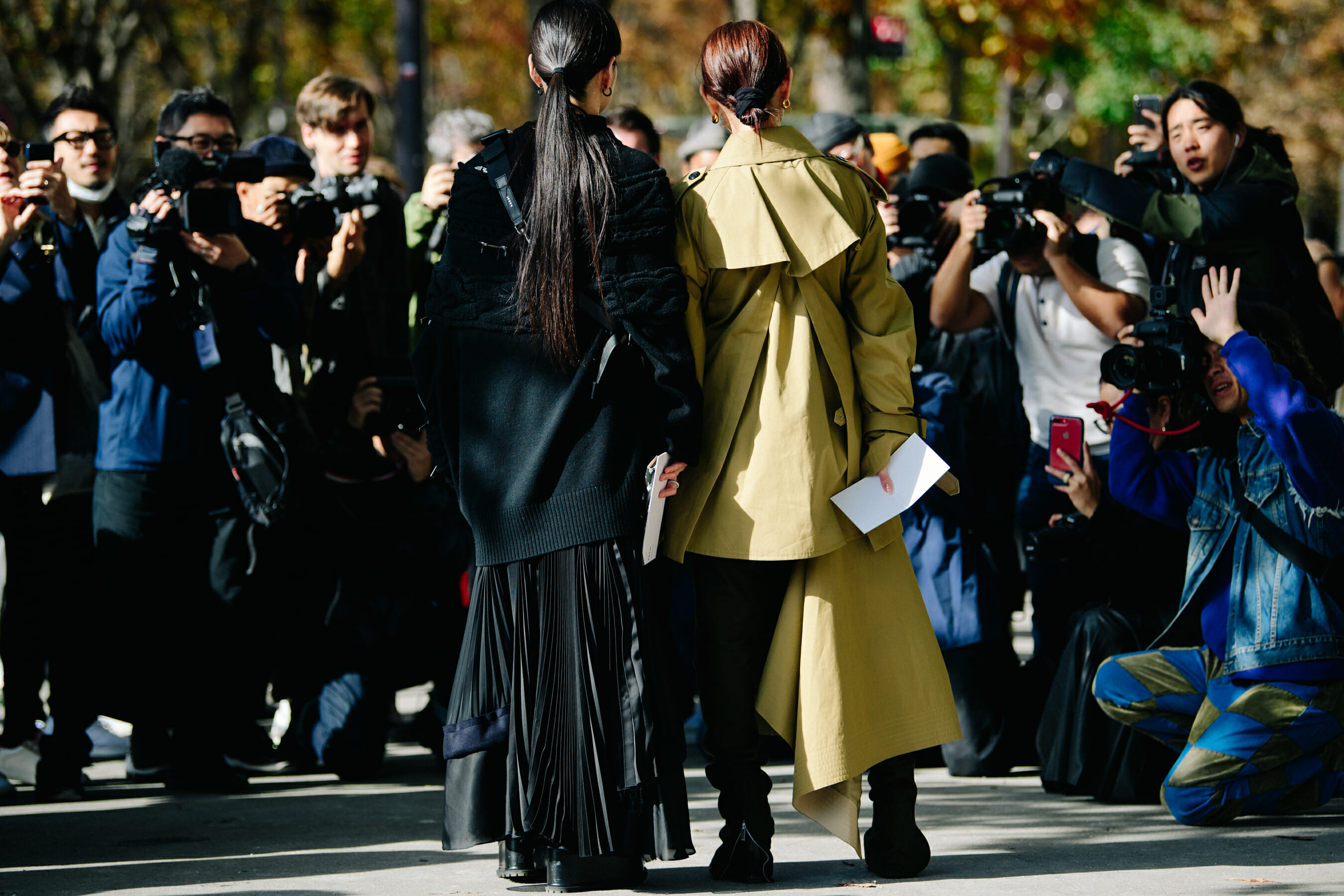 Two Japanese women wearing long coats
