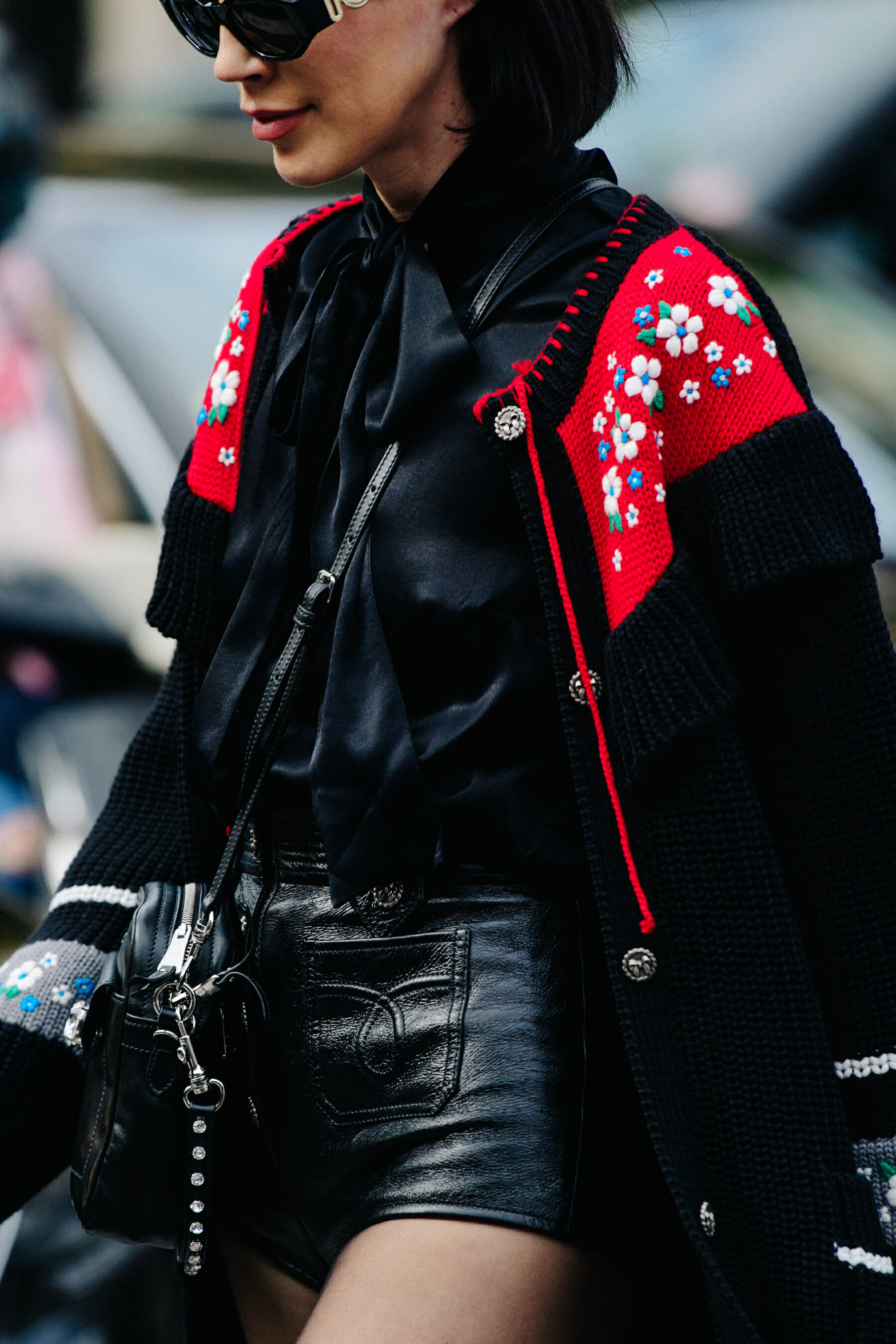 Woman wearing red and black cardigan