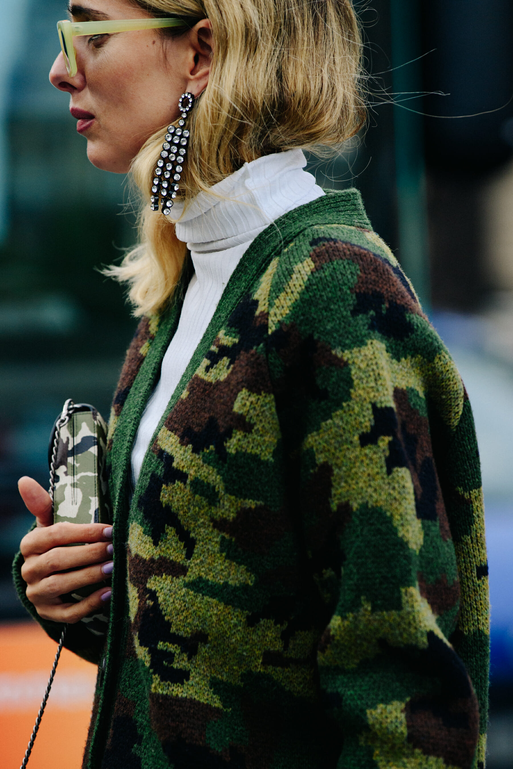 Woman wearing camouflage cardigan