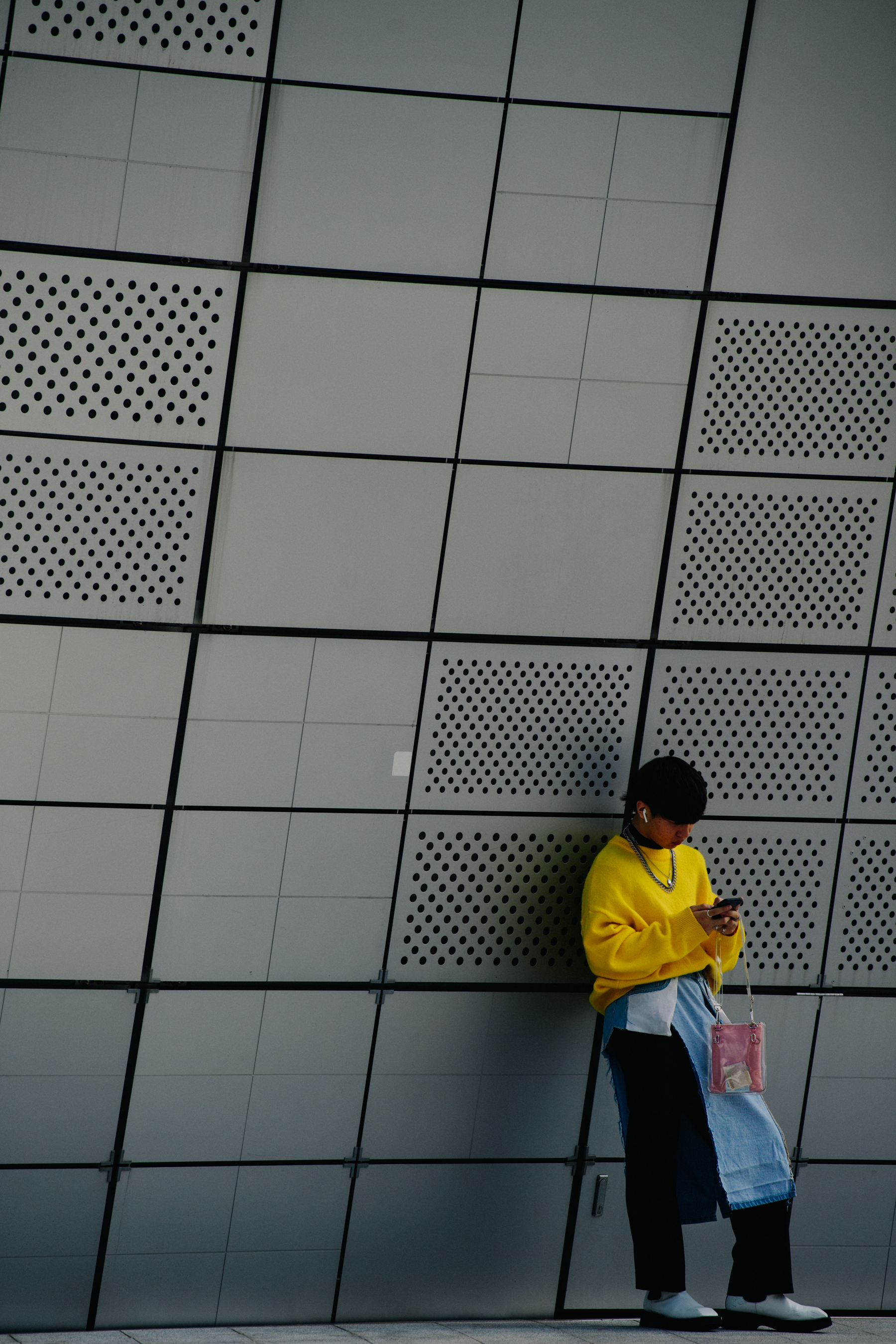 Man wearing yellow jumper