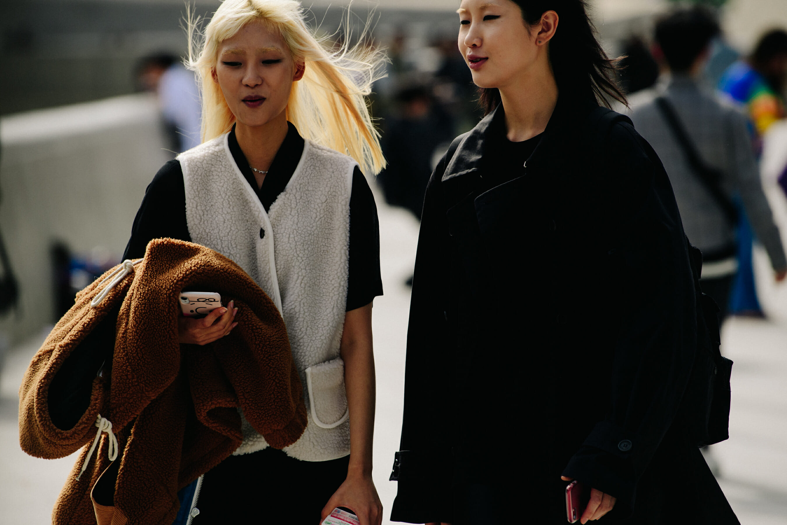 Two women wearing winter outfits