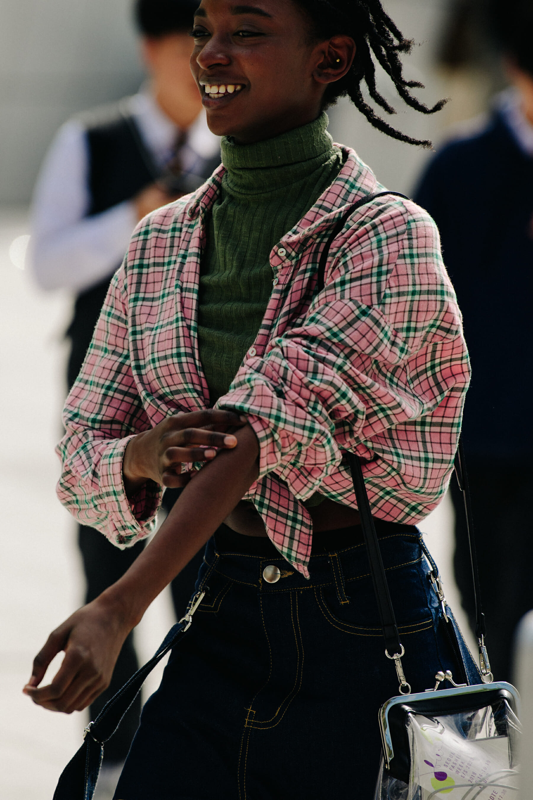Woman wearing pink check shirt