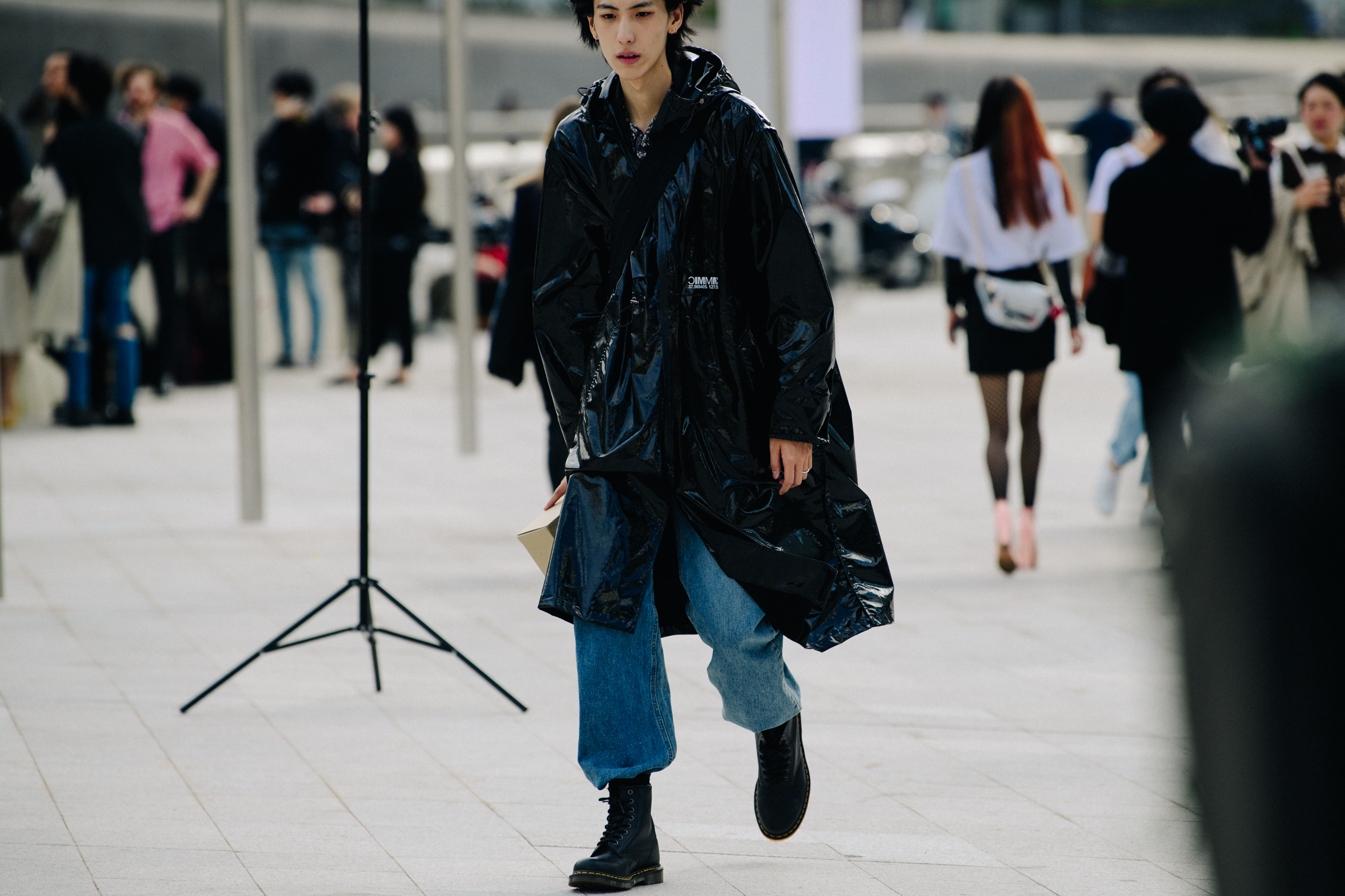 Man wearing long plastic coat