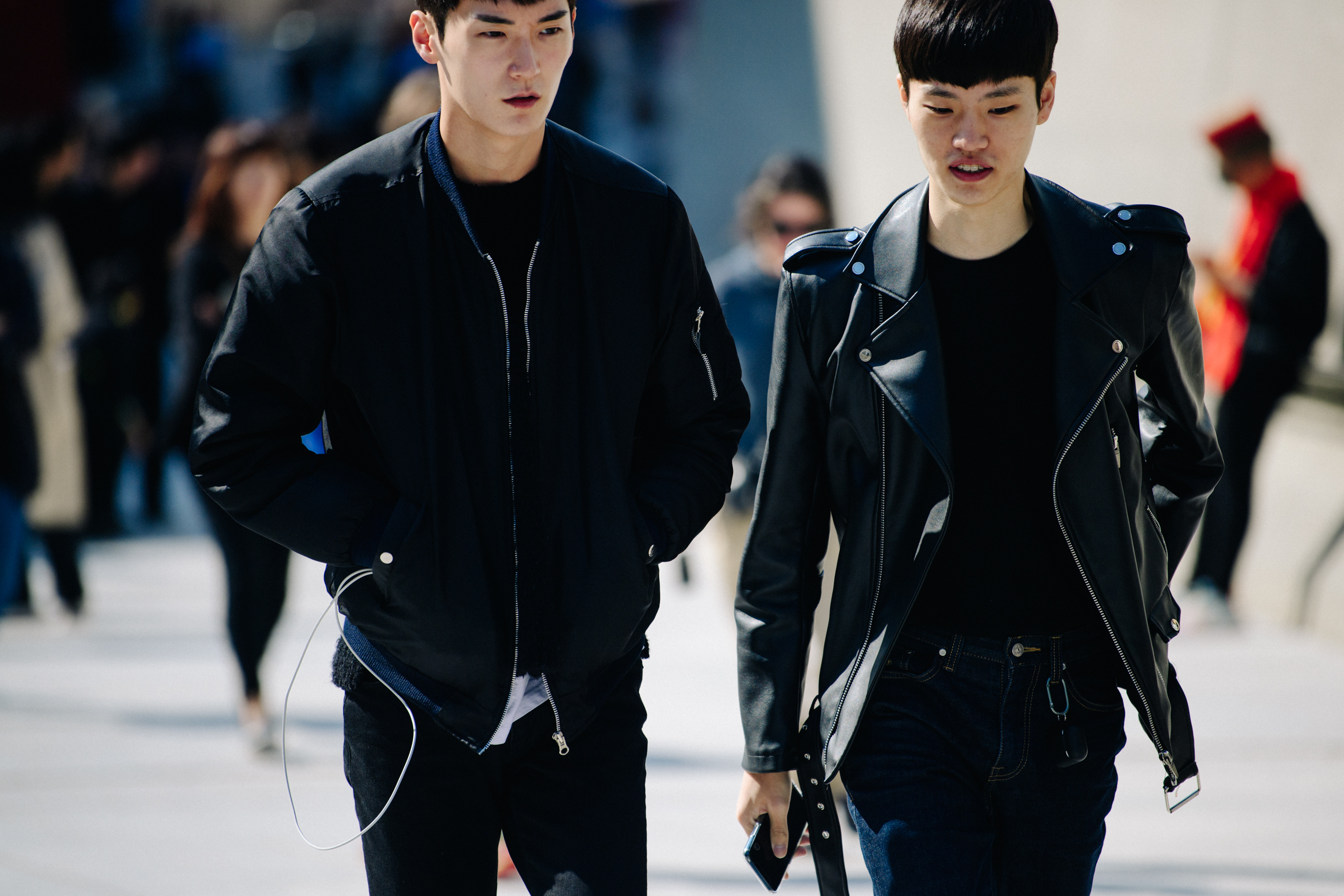 Two men wearing black jackets