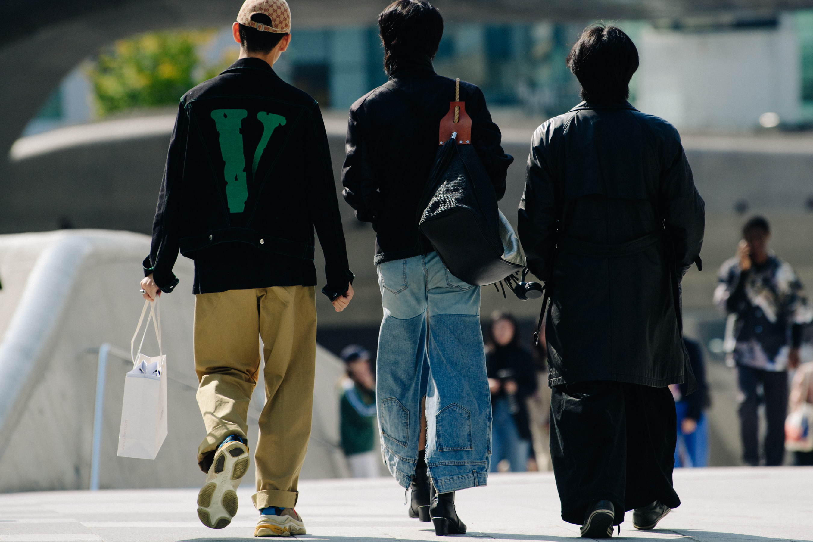 Three men wearing black