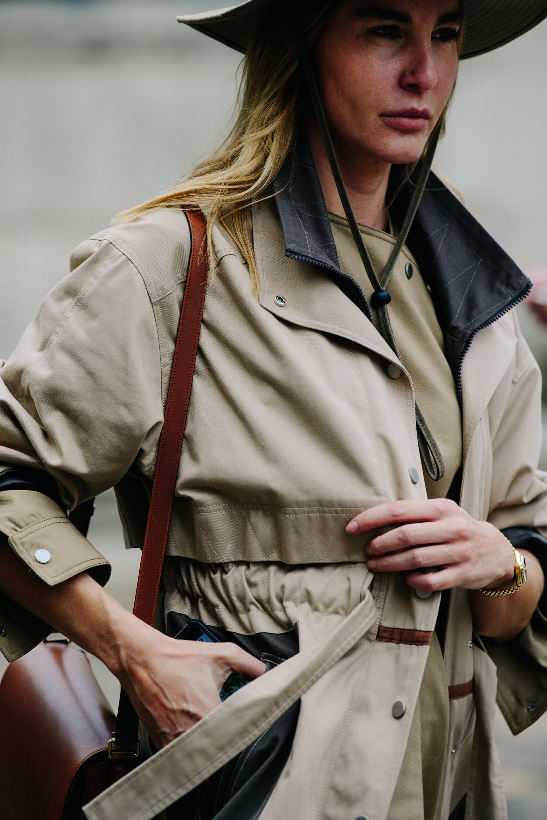 Woman wearing tan coat