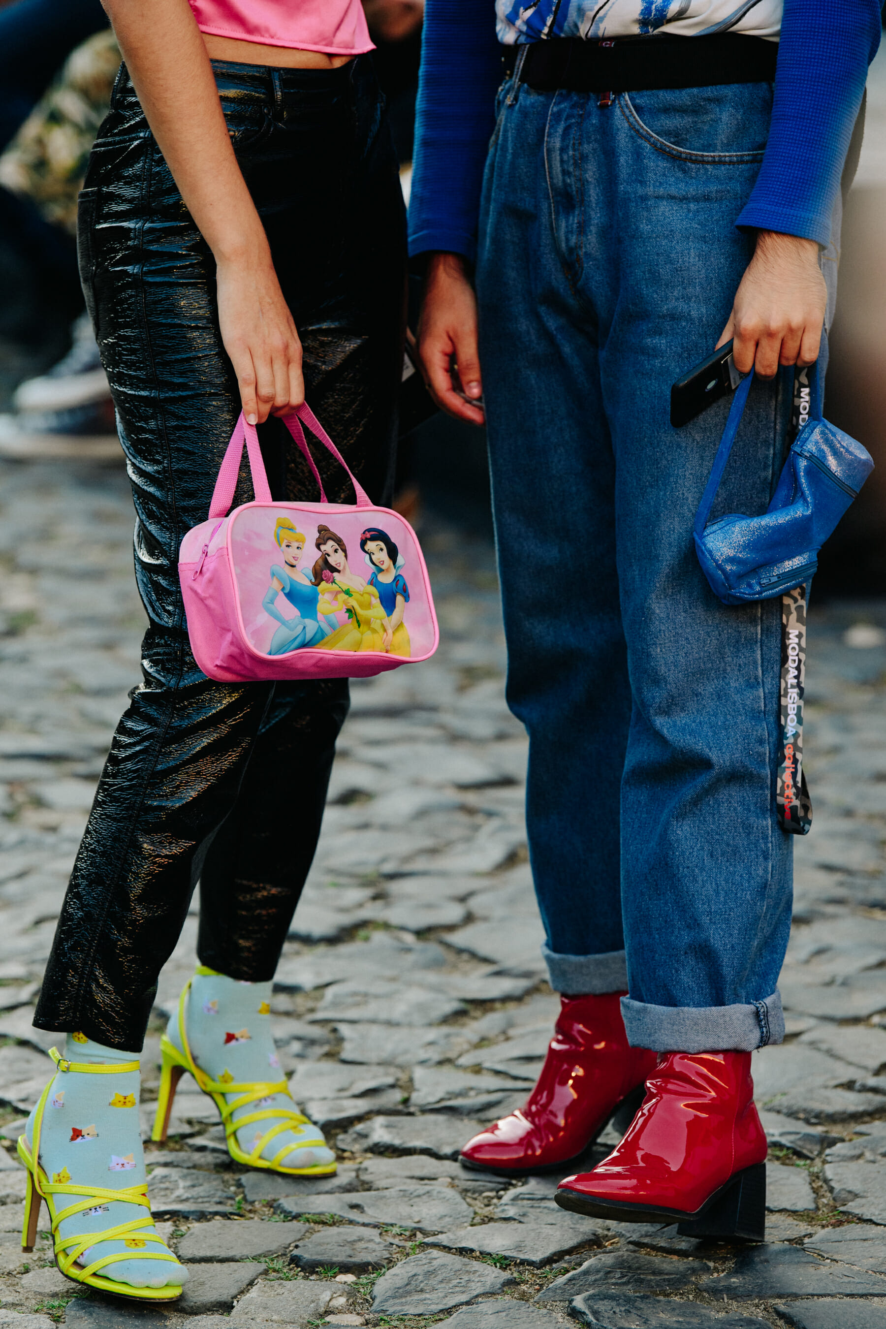 Two women wearing colourful heels