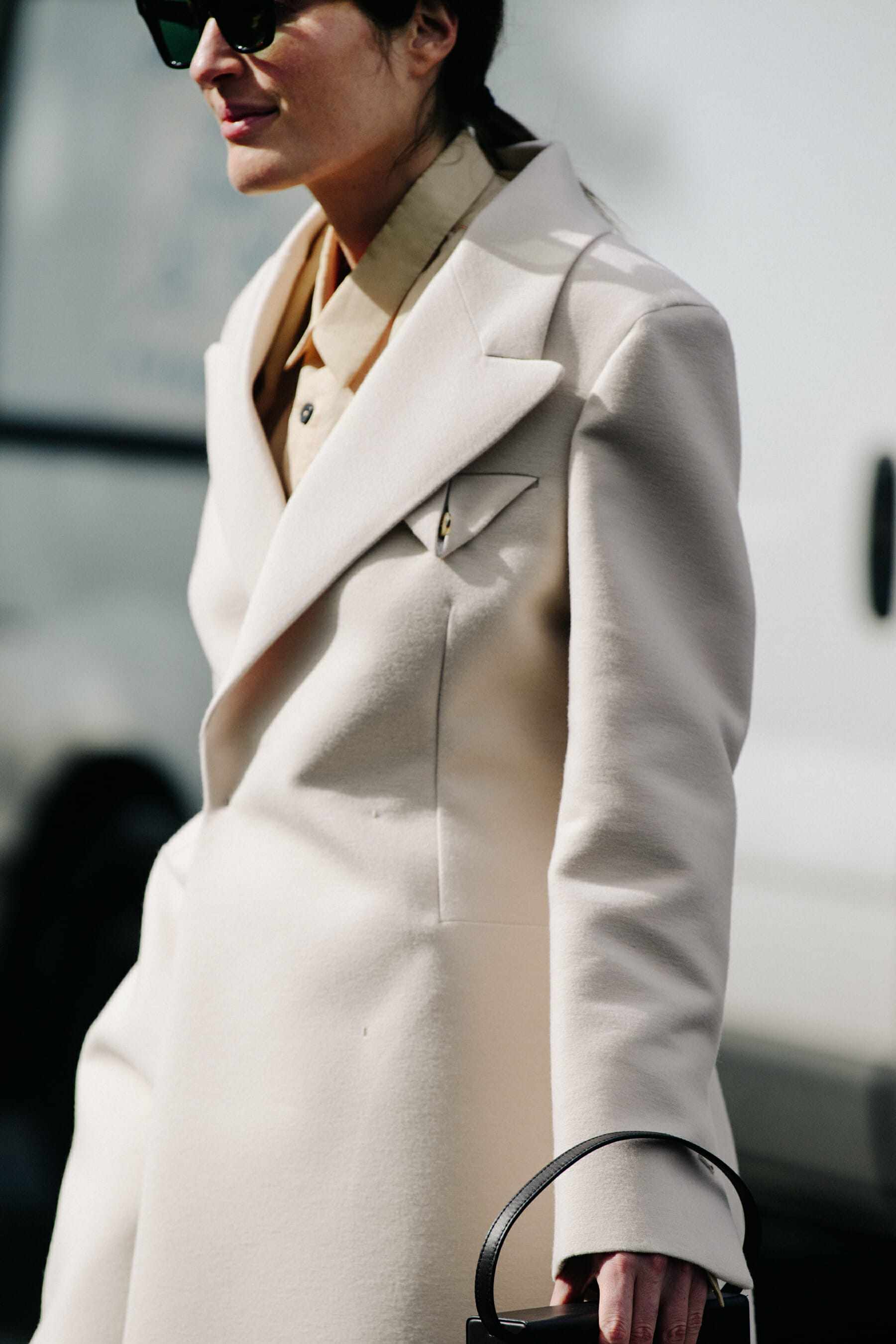Woman wearing white coat