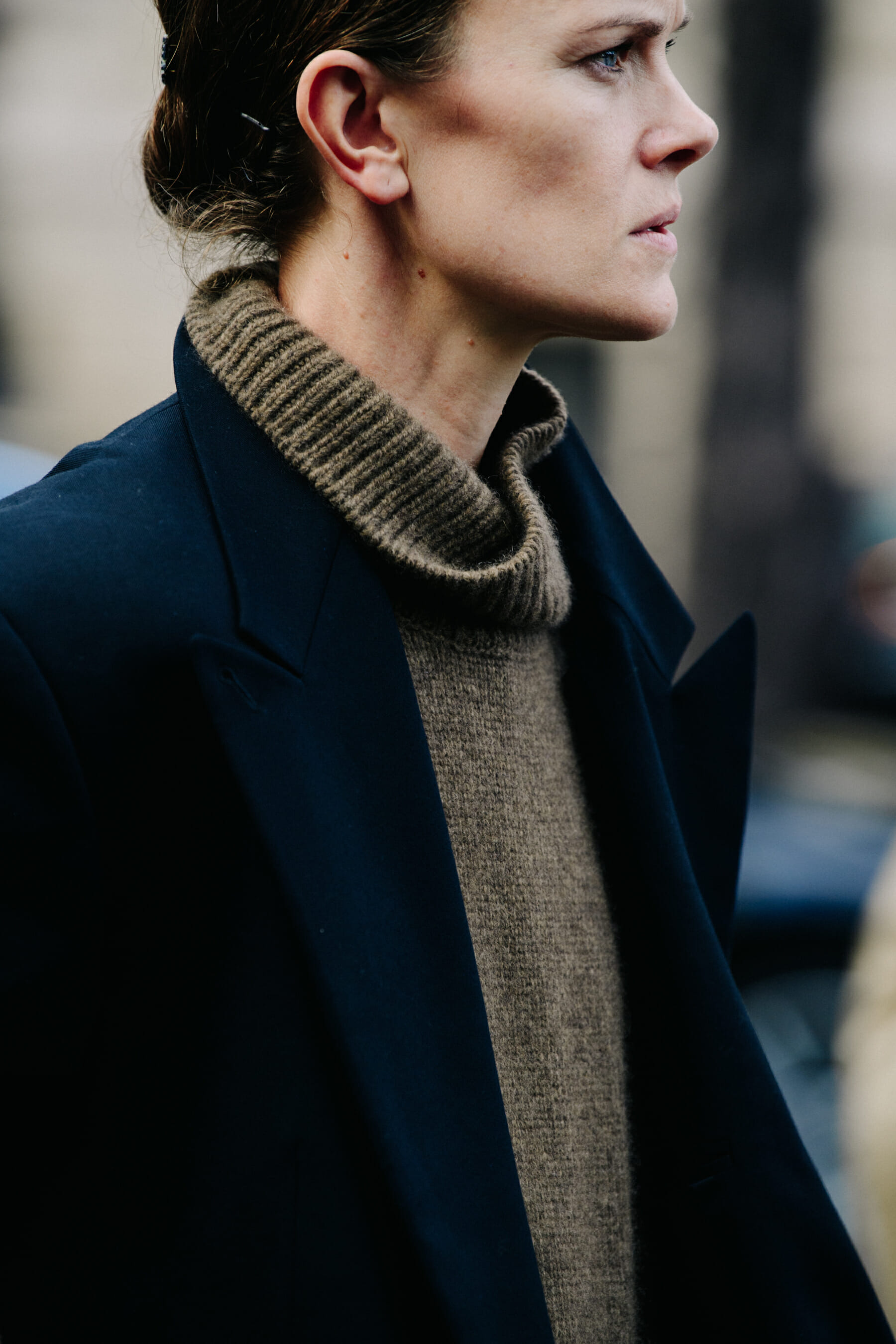 Woman wearing brown jumper