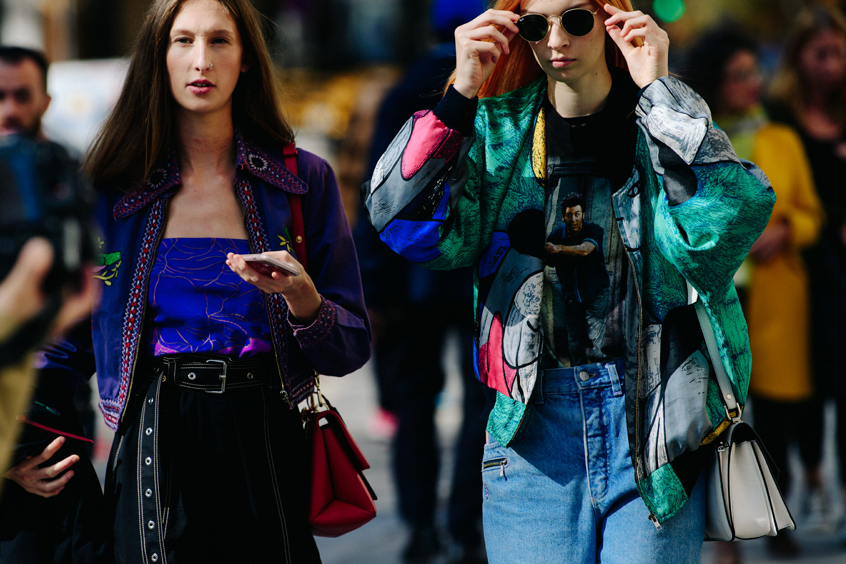 Two models wearing colourful jackets