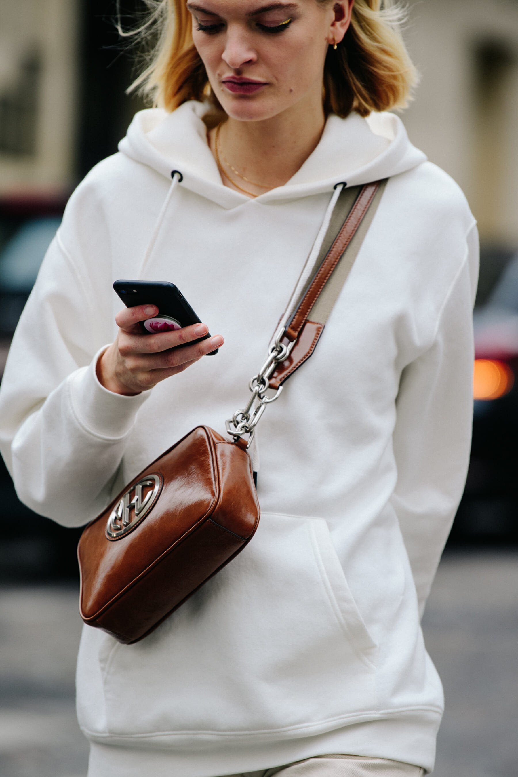 Model wearing white hoodie