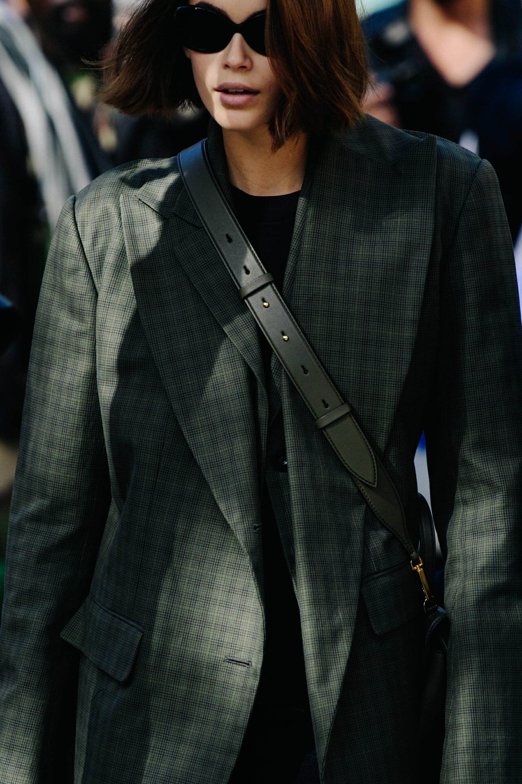 Supermodel wearing check suit