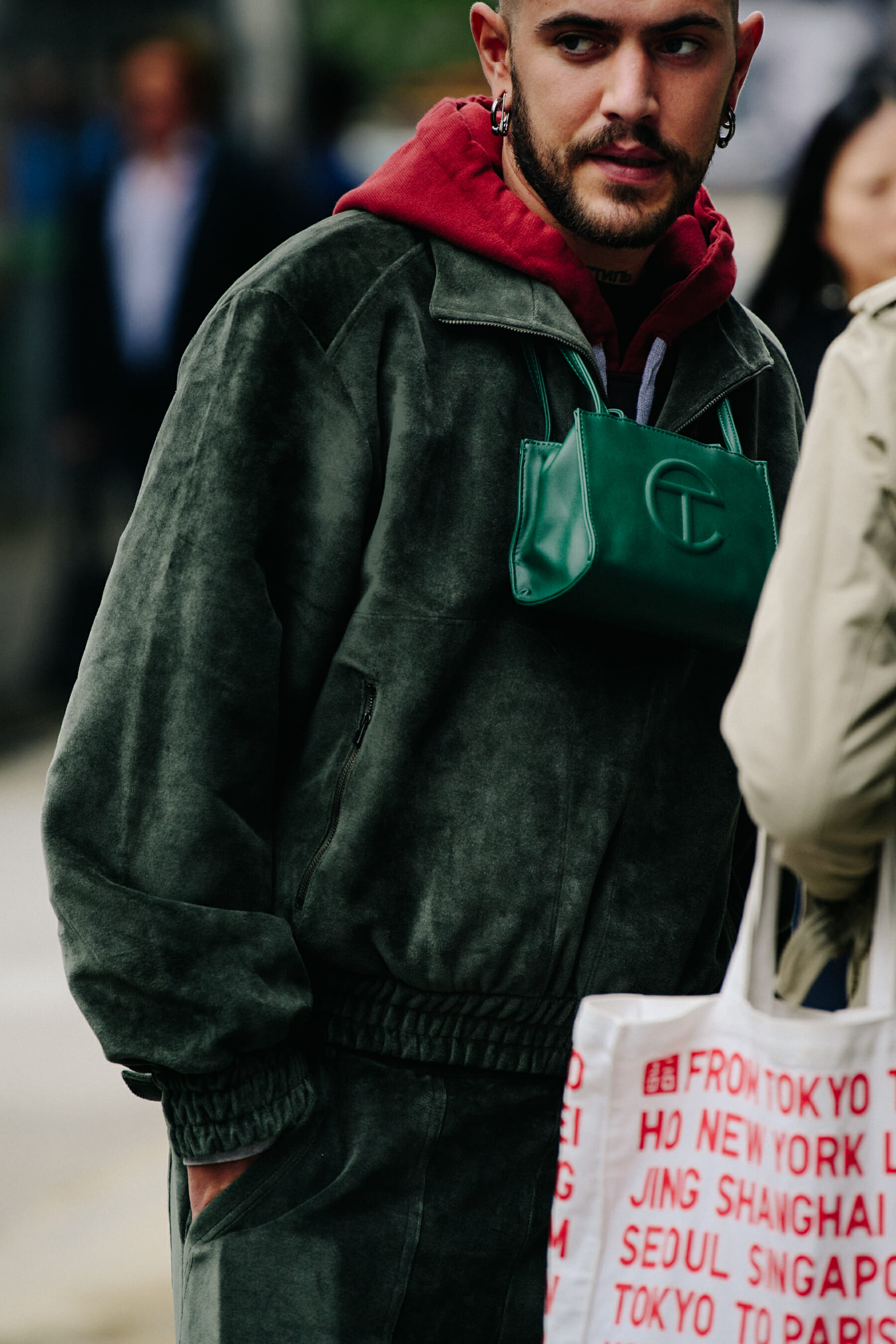 Man wearing green tracksuit