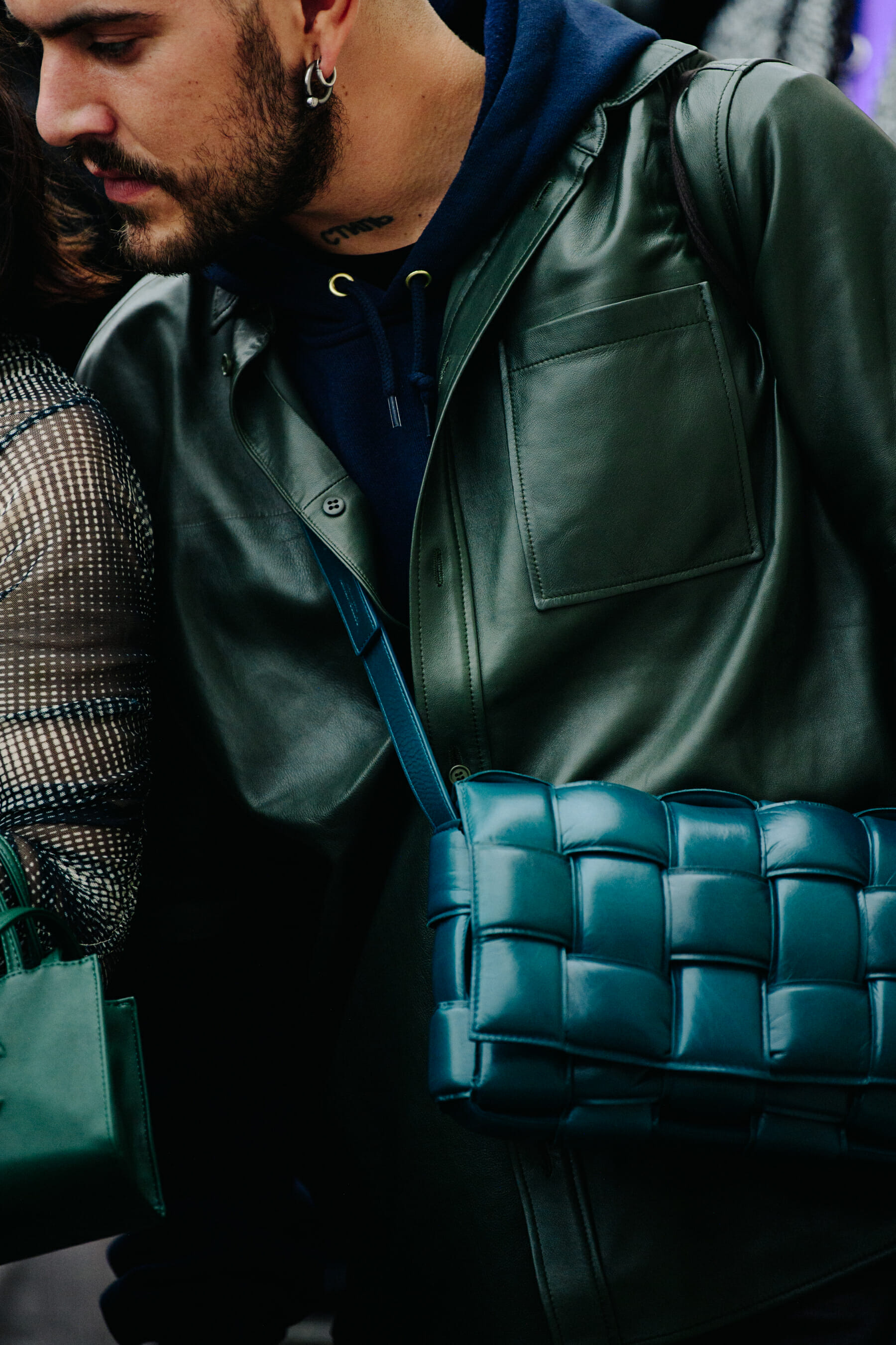 Man wearing green leather coat