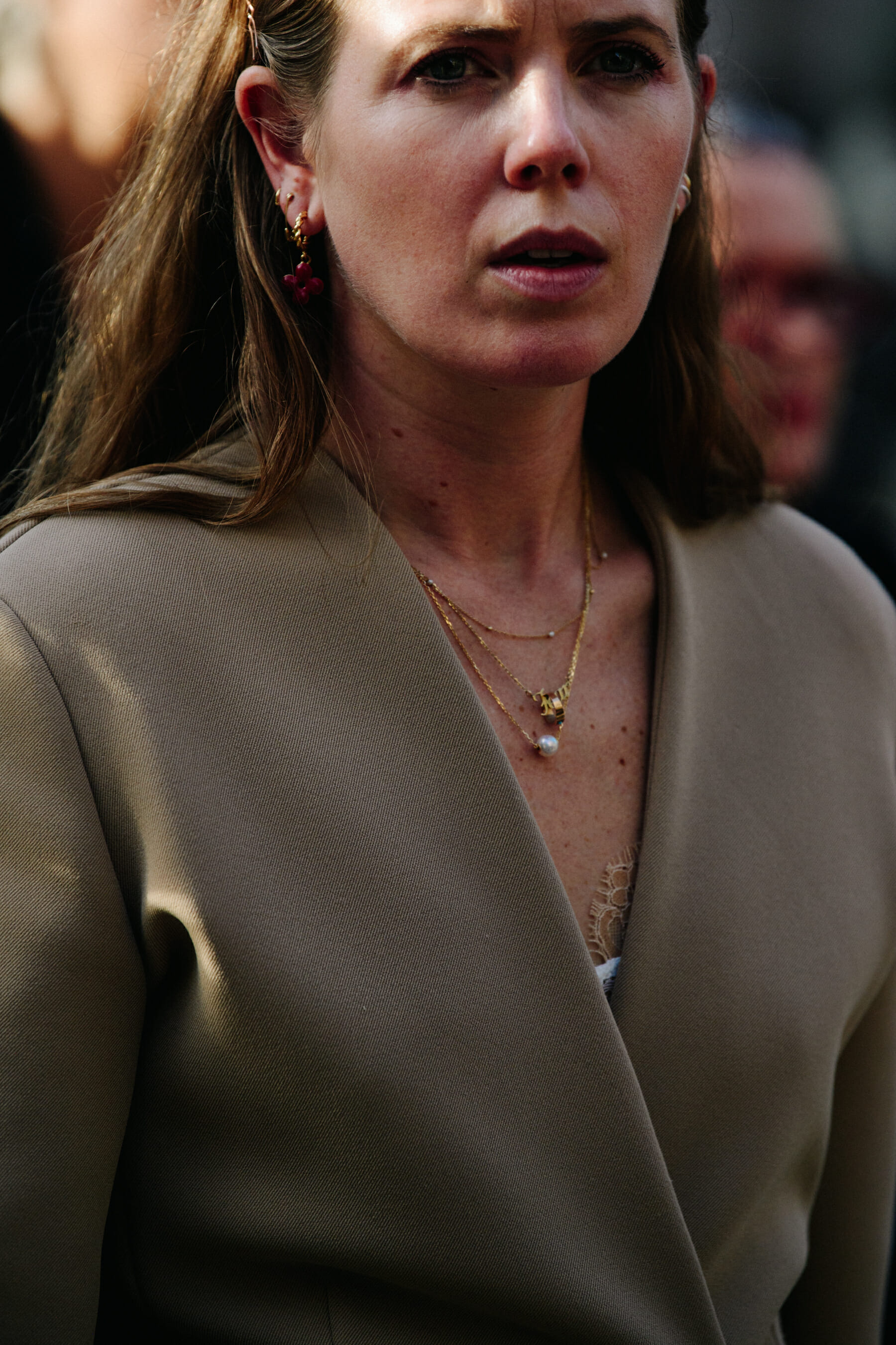 Woman wearing tan jacket