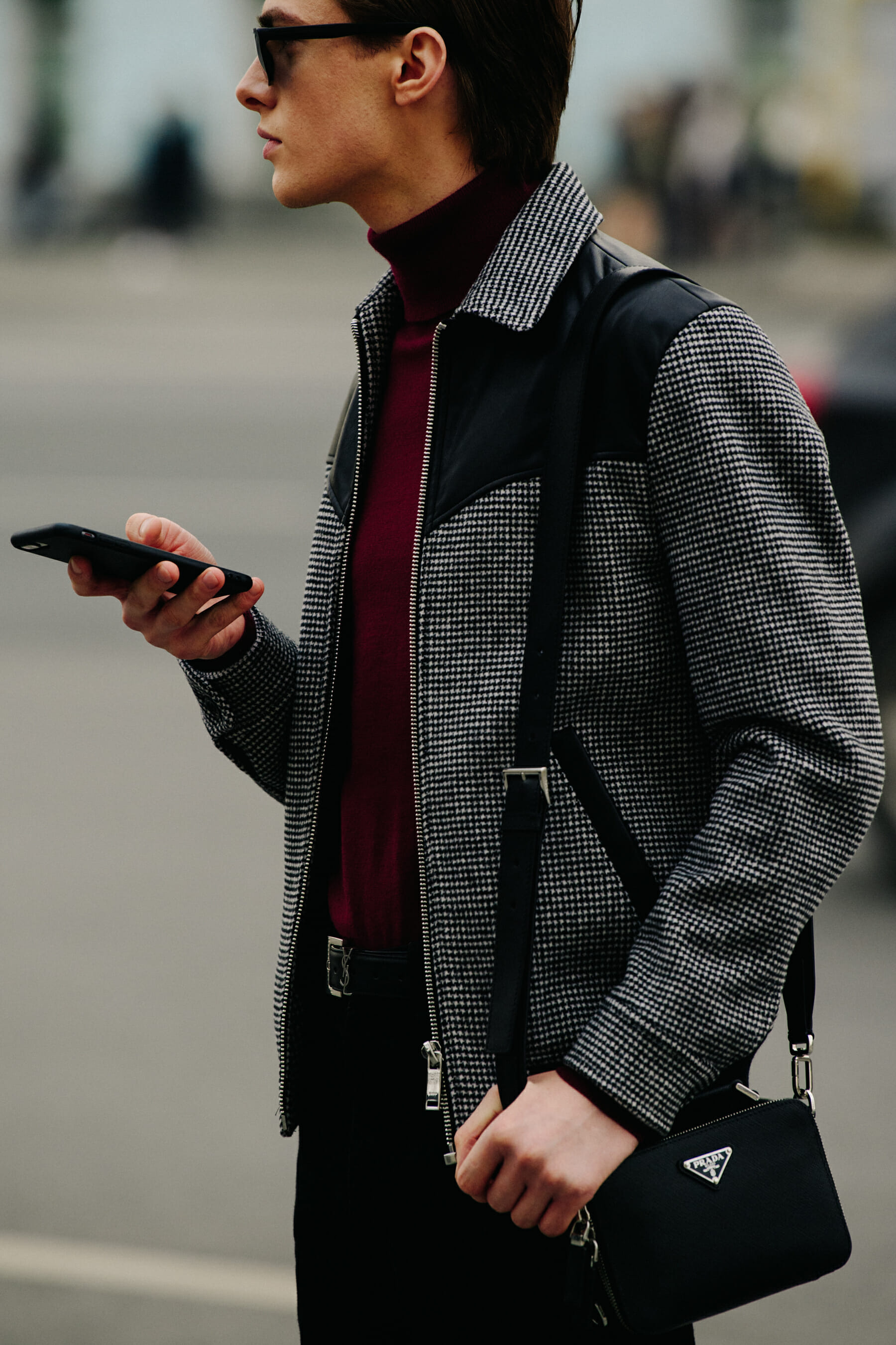 Man carrying Prada bag
