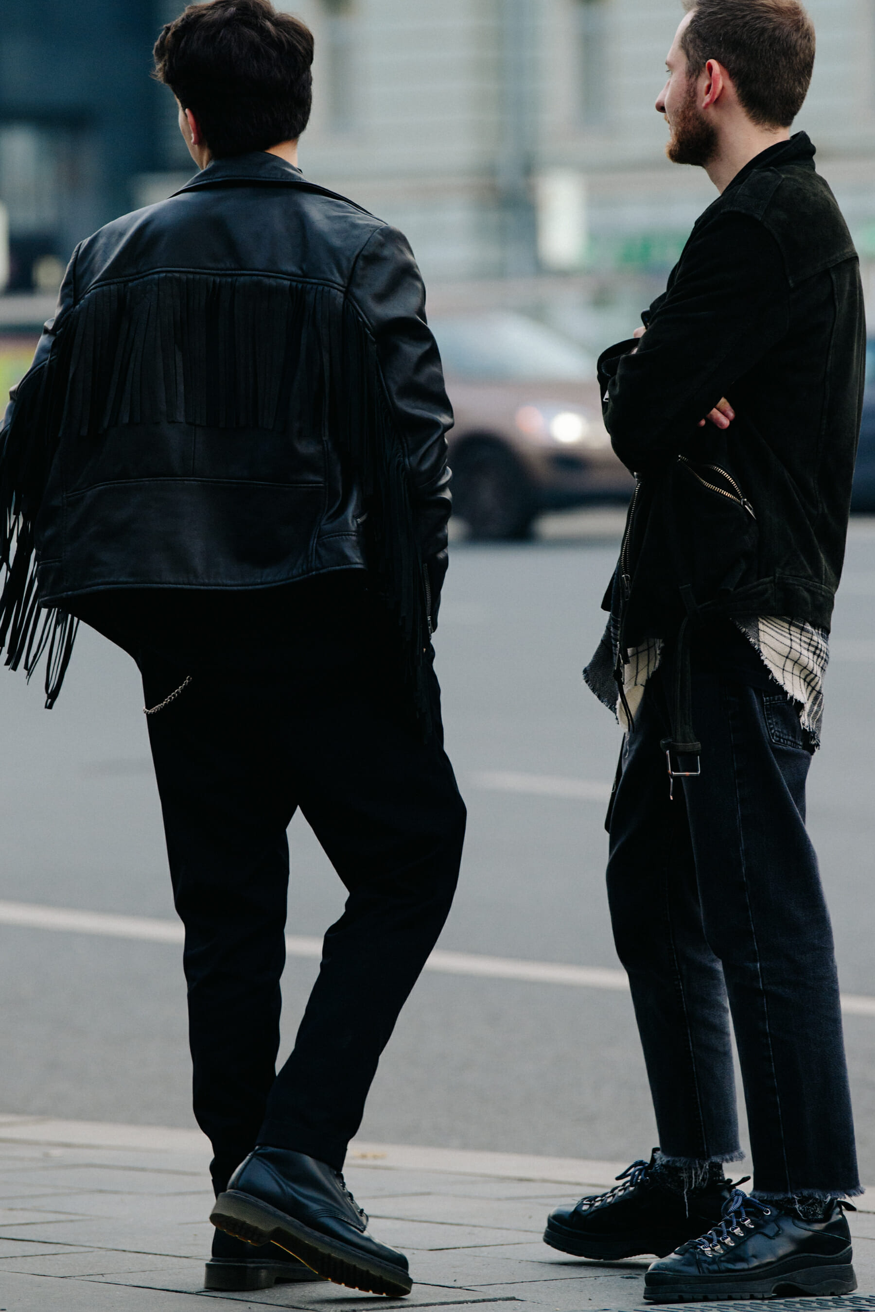 Two men wearing dark clothing