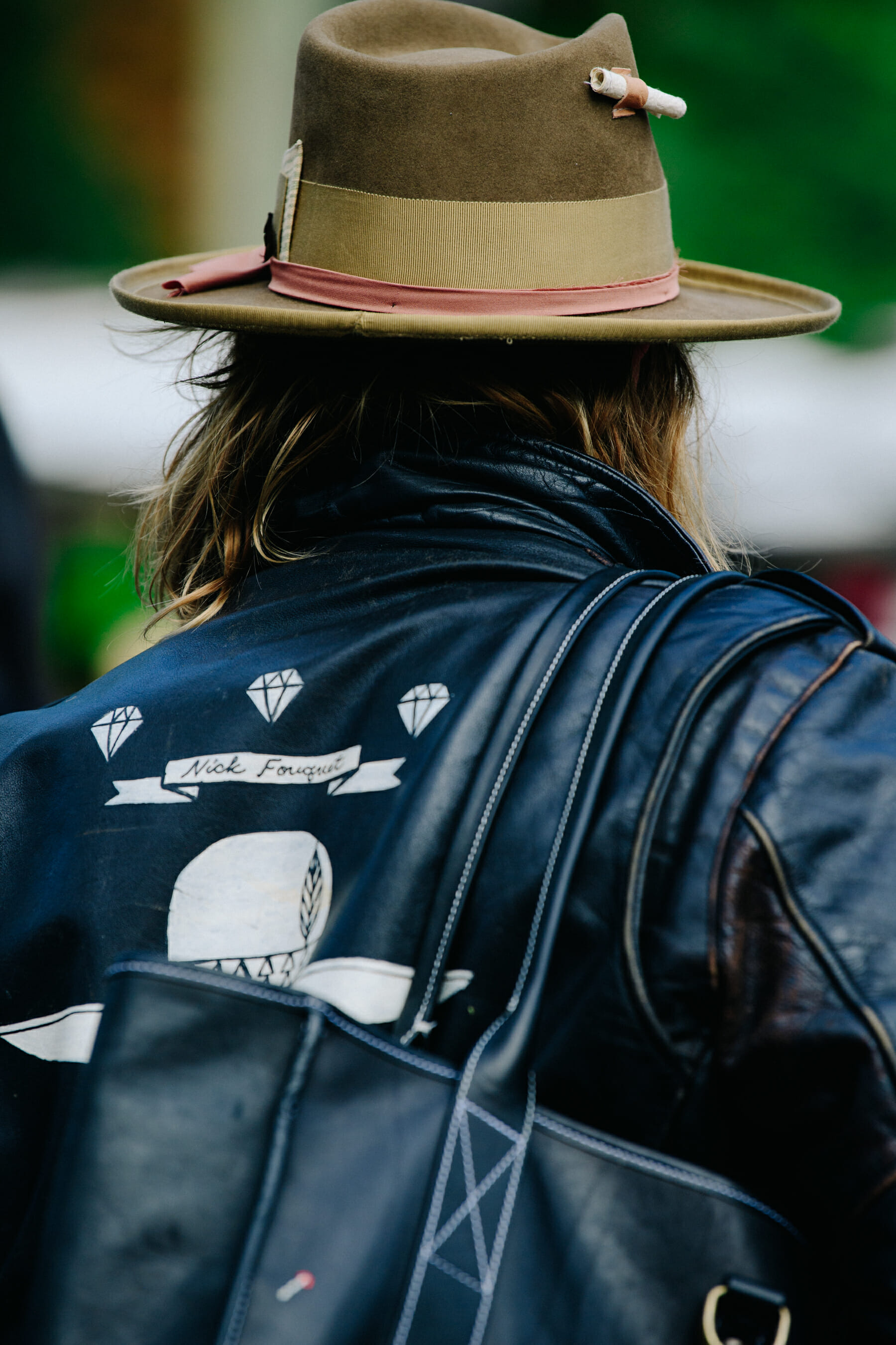 Hat designer wearing leather jacket