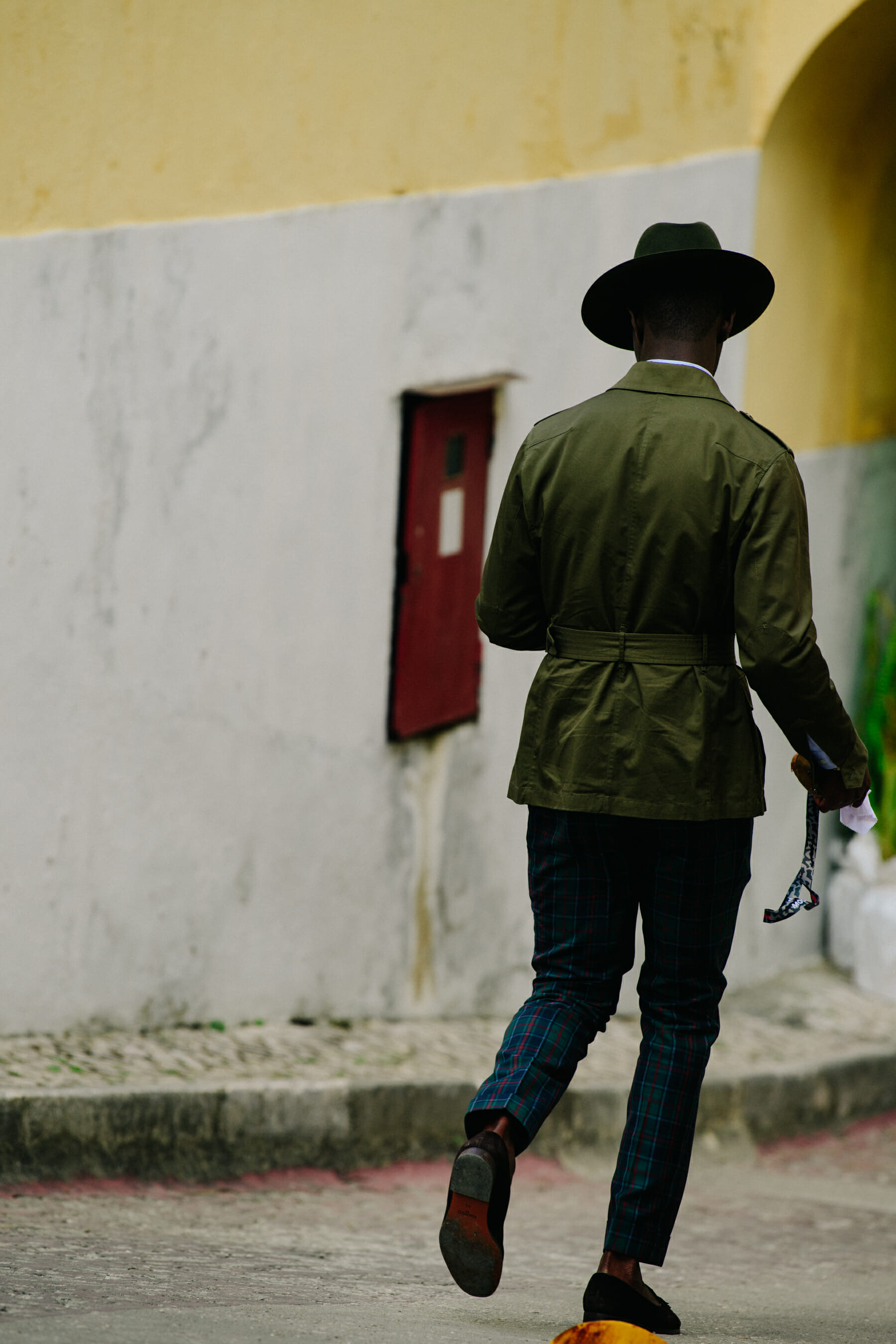 Man wearing green hat