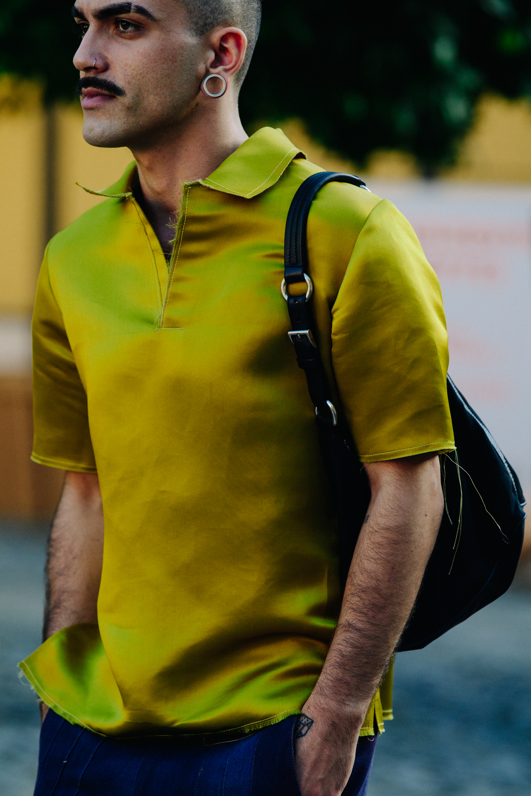 Man wearing yellow shirt