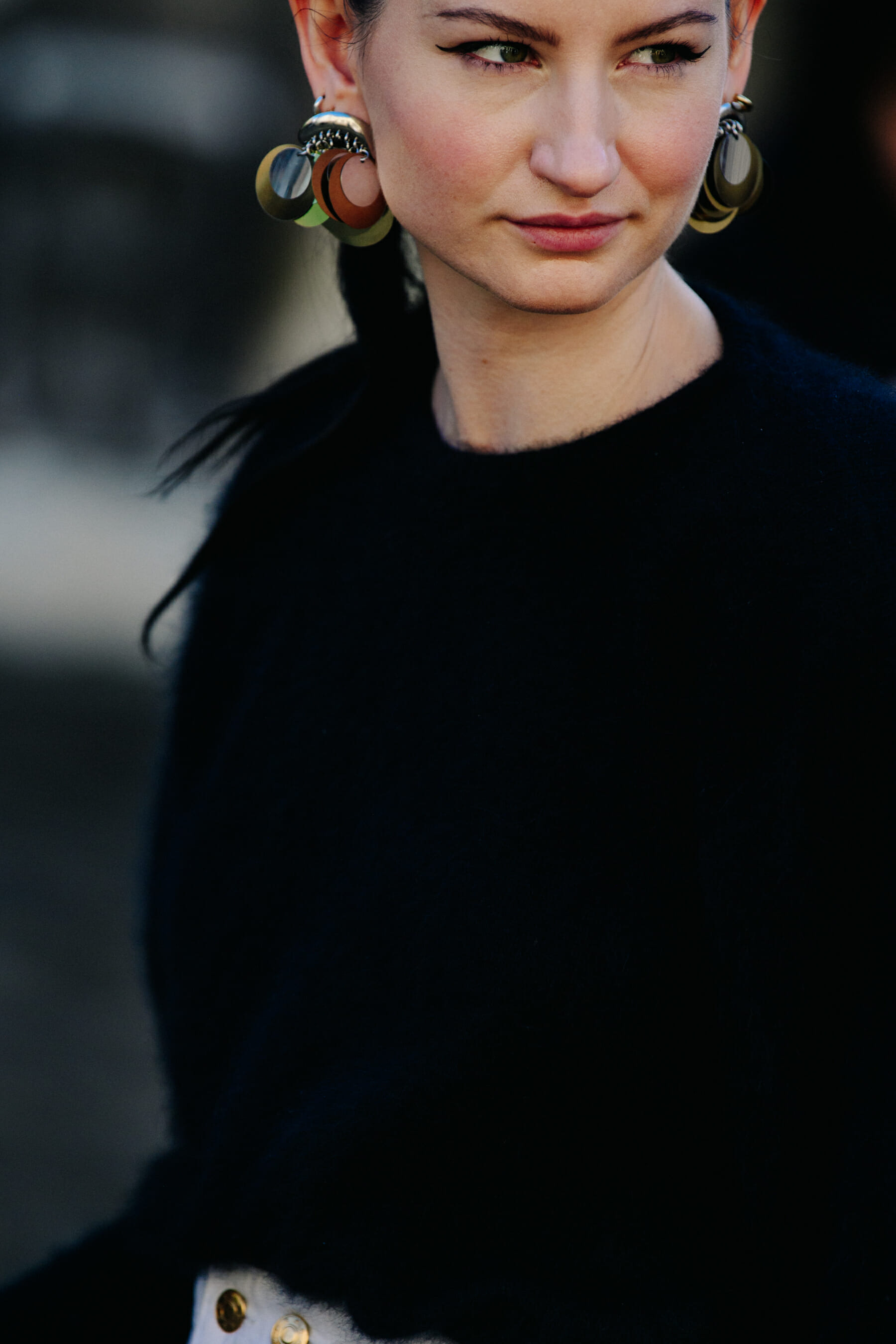 Woman wearing large earrings