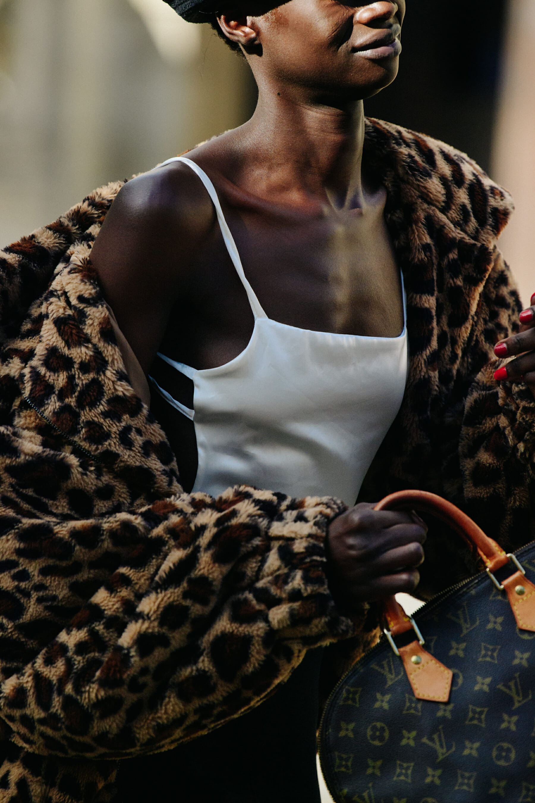 Model carrying Louis Vuitton bag